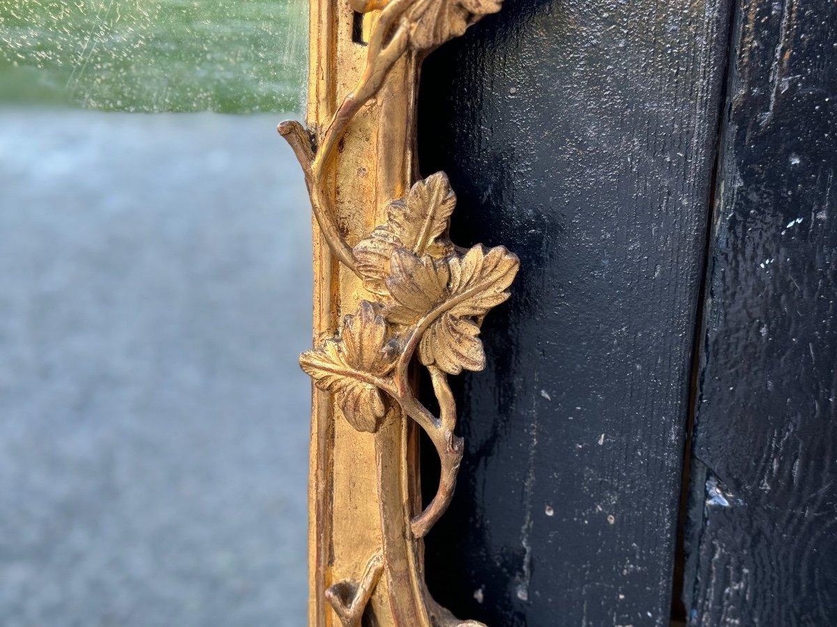 French Louis XV Mirror In Carved And Gilded Wood With Parecloses For Sale