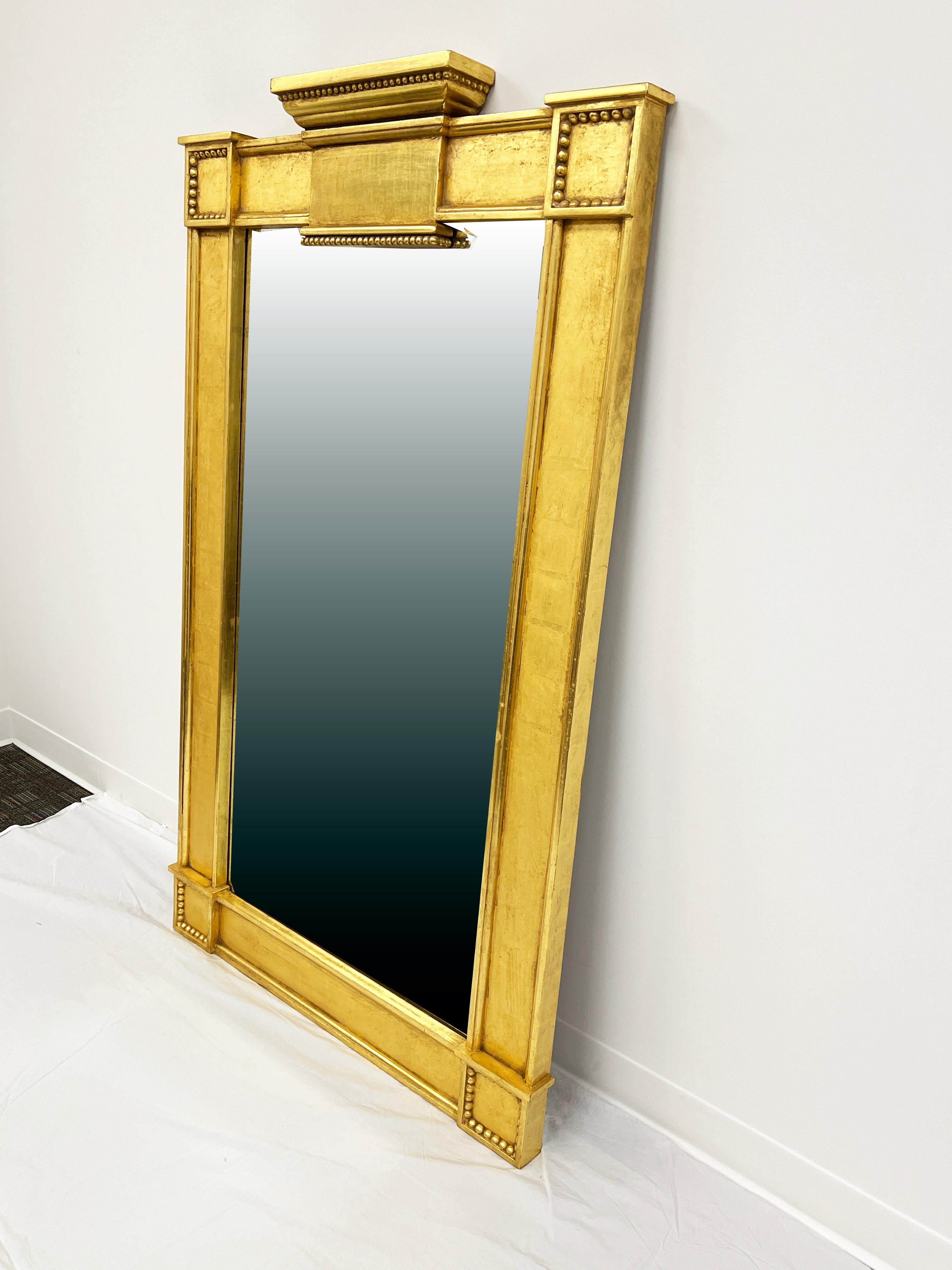 A Louis XV neoclassical mirror inspired by designs from the Grand Trianon Palace of Versailles, commissioned by the renowned interior designer Celeste Cooper from the studios of J. Robert Scott in Los Angeles. This extremely fine quality replica is