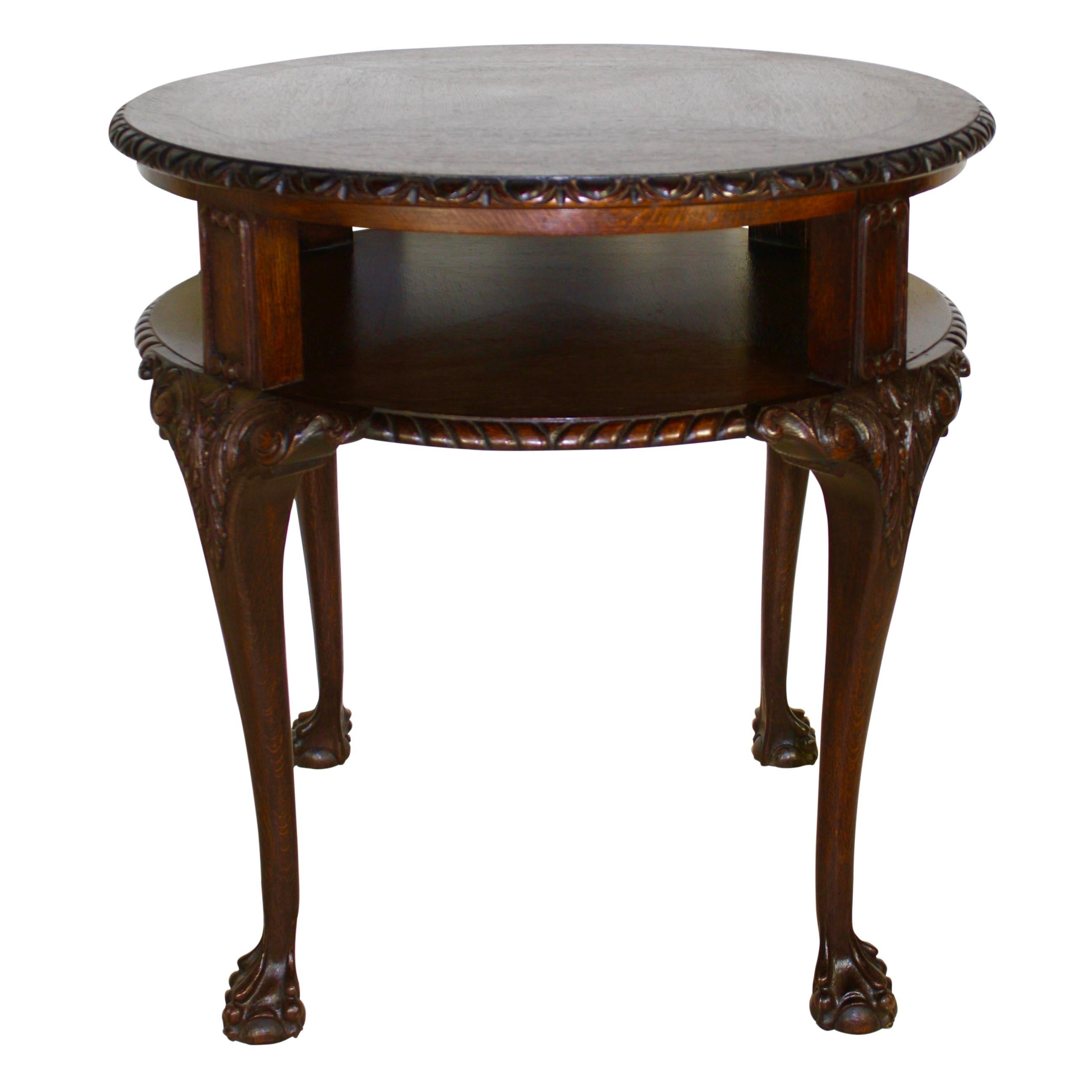 Delicately inlaid with a single band, this elegant side table features a top tier with a beveled edge and egg and dart trim. The lower tier sits 5.5 inches below the bottom of the top tier and is finished with rope trim around the outer edge. The