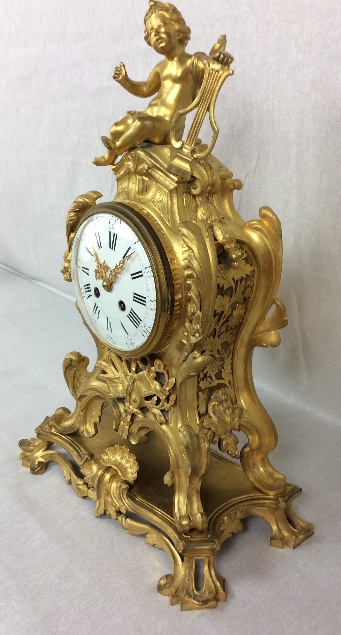 12 of 19
A very large and fine antique French clock set, circa 1880. It is of Rococo design in the manner of Juste Aurele Meissonier and boldly modeled in gilt bronze. Waisted keyhole shape with acanthus leaf shoulders, 'C' scroll feet standing on