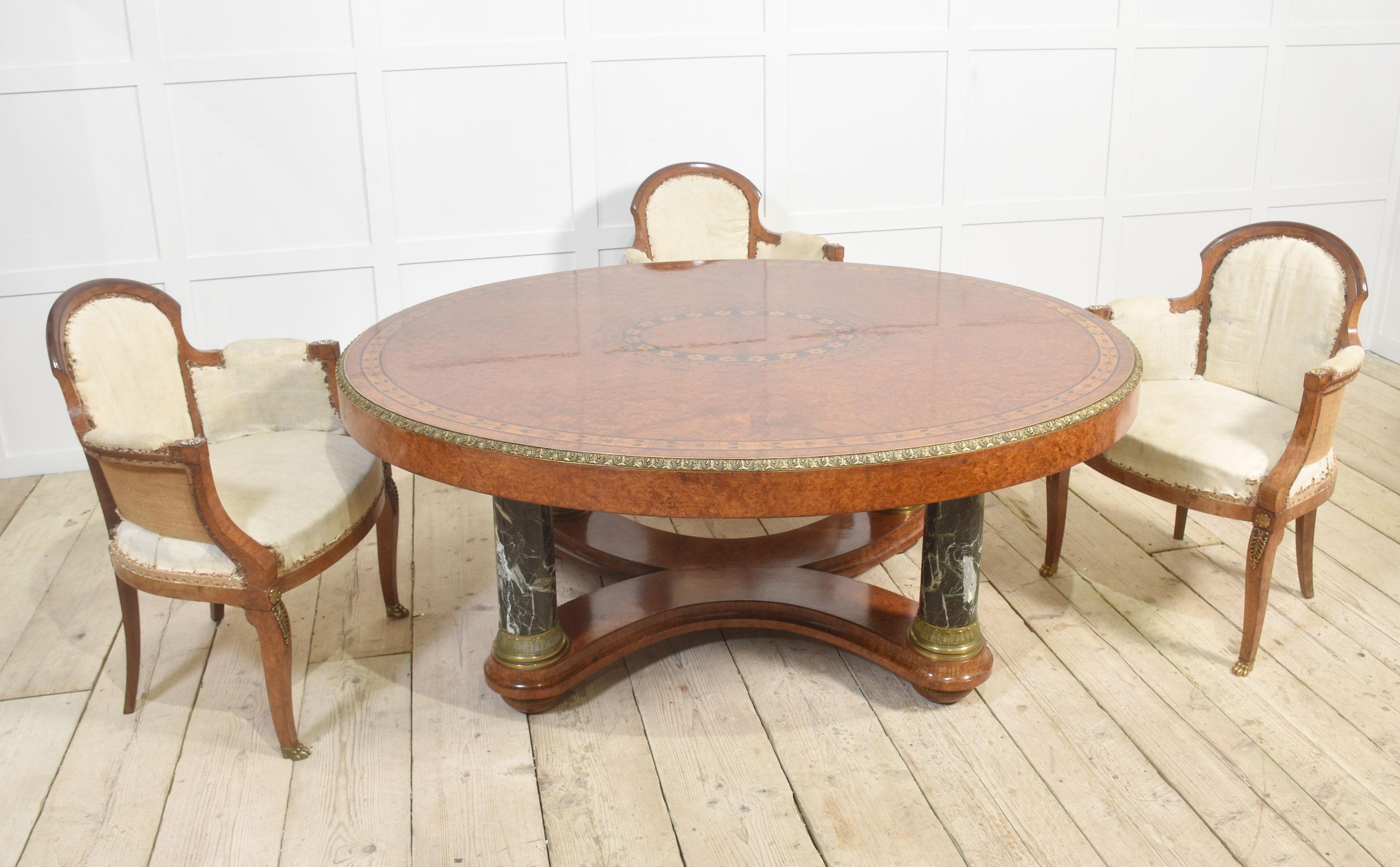 Louis XV-style hall table, the impressive oval top with intricate inlays enclosed by a well-cast border. Supported on four green veined marble columns and a shaped platform base below. All raised on bun feet.
Dimensions
Height 29 Inches
Width 63