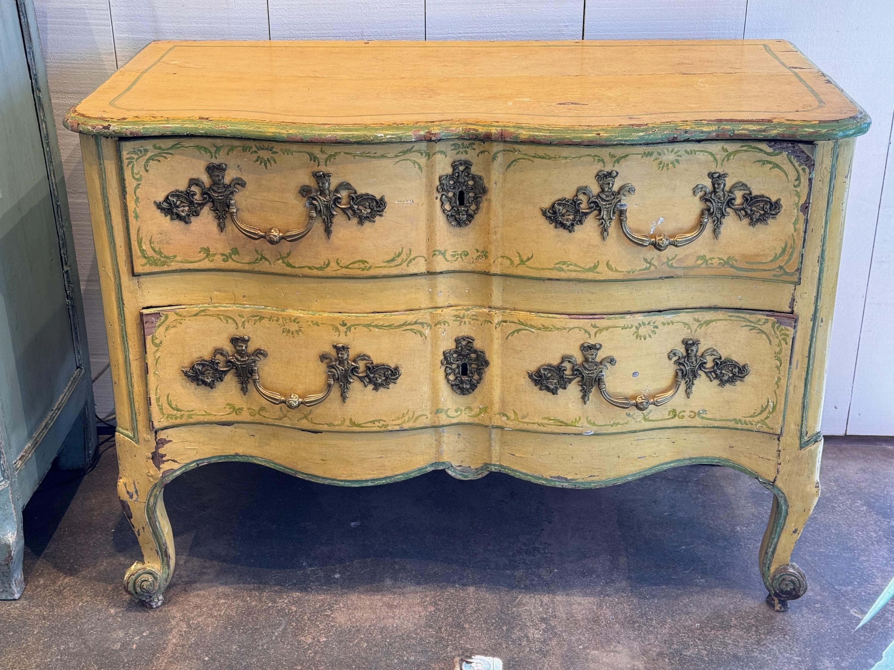An 18thc painted French Commode. It has beautiful decoration and great hardware.
