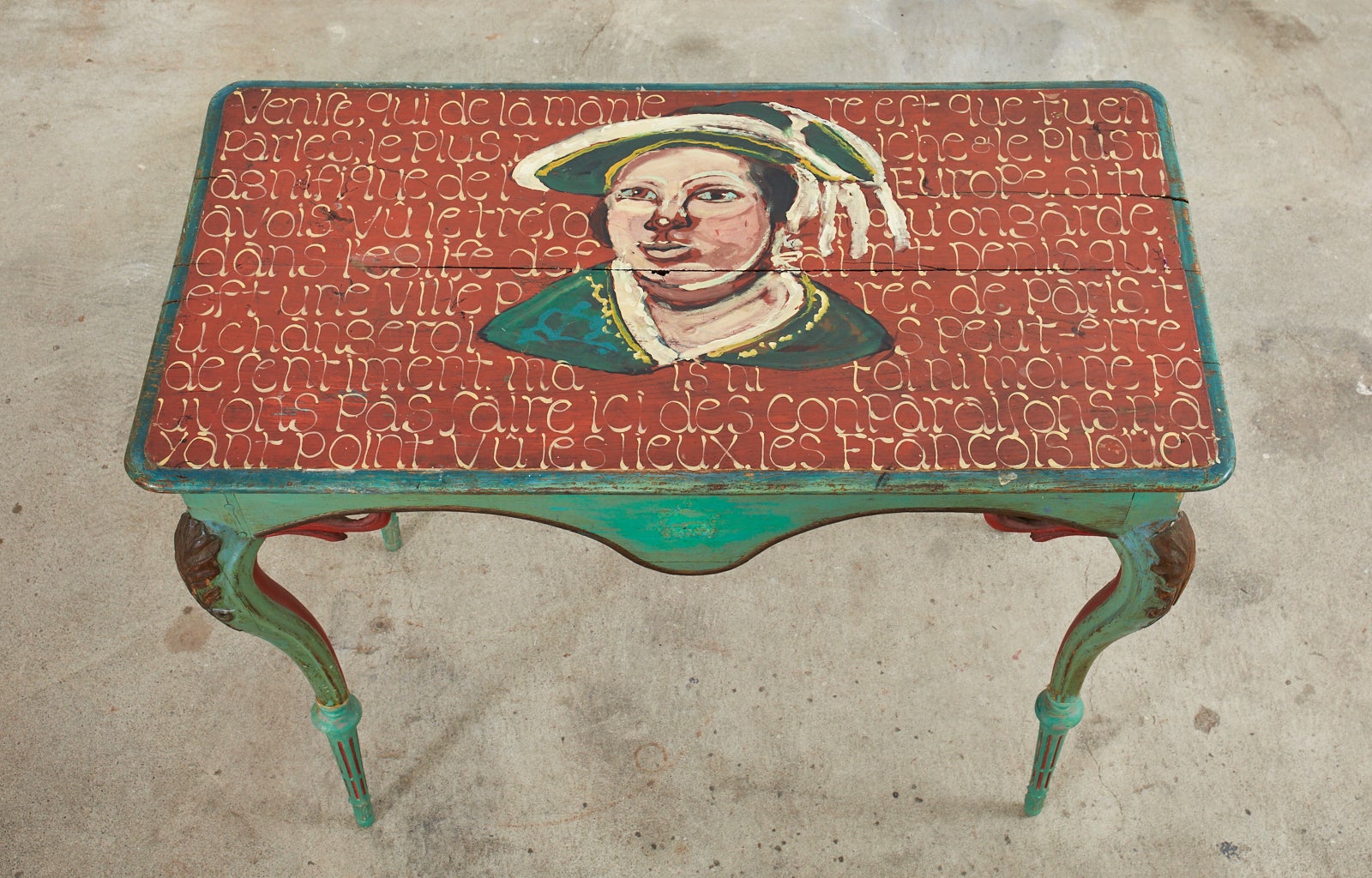 Fantastic 18th century French Louis XV entry or foyer console table lacquer painted by artist Ira Yeager (American 1938-2022). The table features a bust of a French Nobleman painted over a French script on a scarlet red ground. The table has a