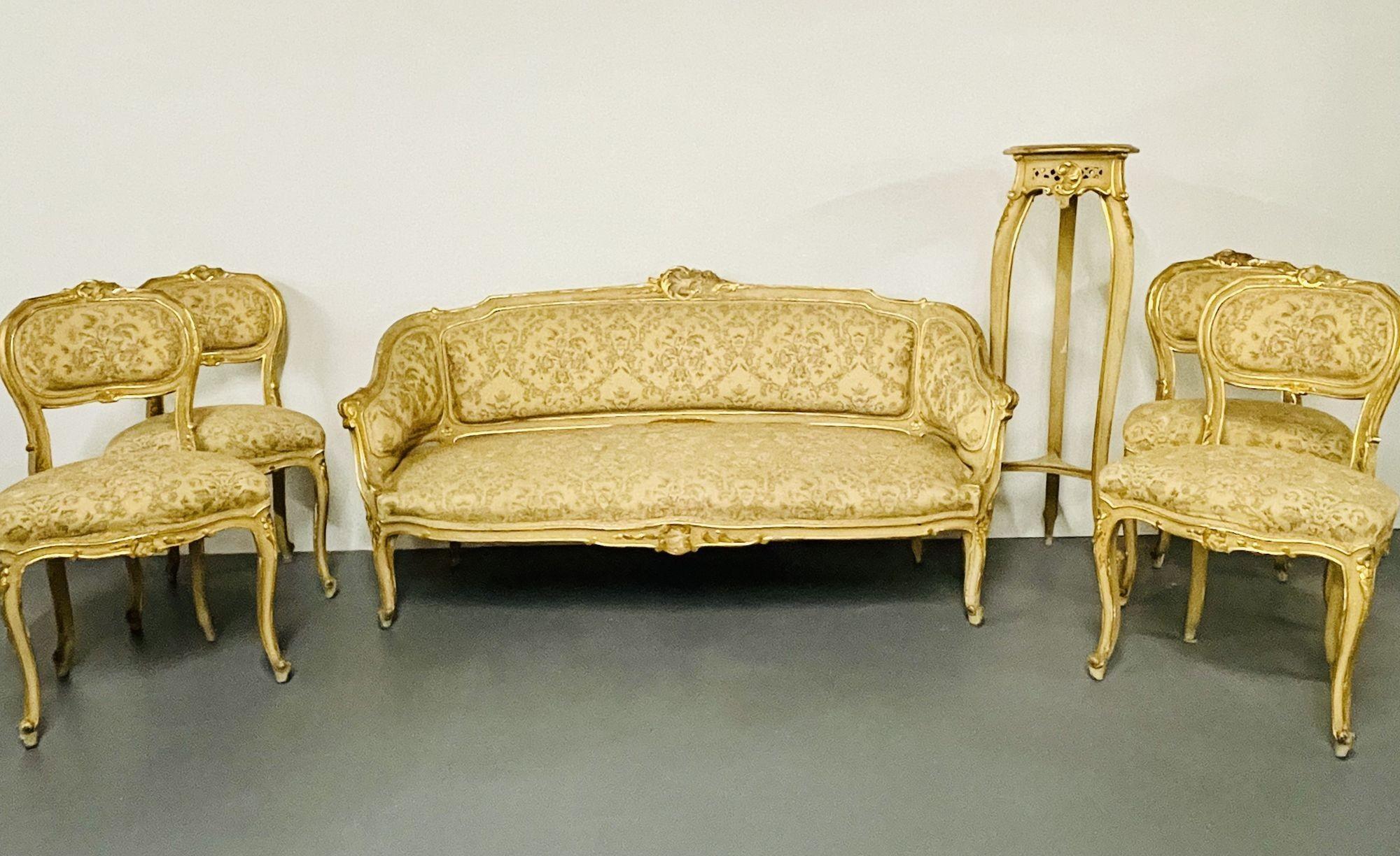 A seven piece parcel gilt and painted Italian salon set circa 1900.
 
Comprised of a settee, four side chairs, marble top table and pedestal. Can purchase one or all seven pieces. Priced to sell. Upholstery needs to be cleaned or changed. Paint