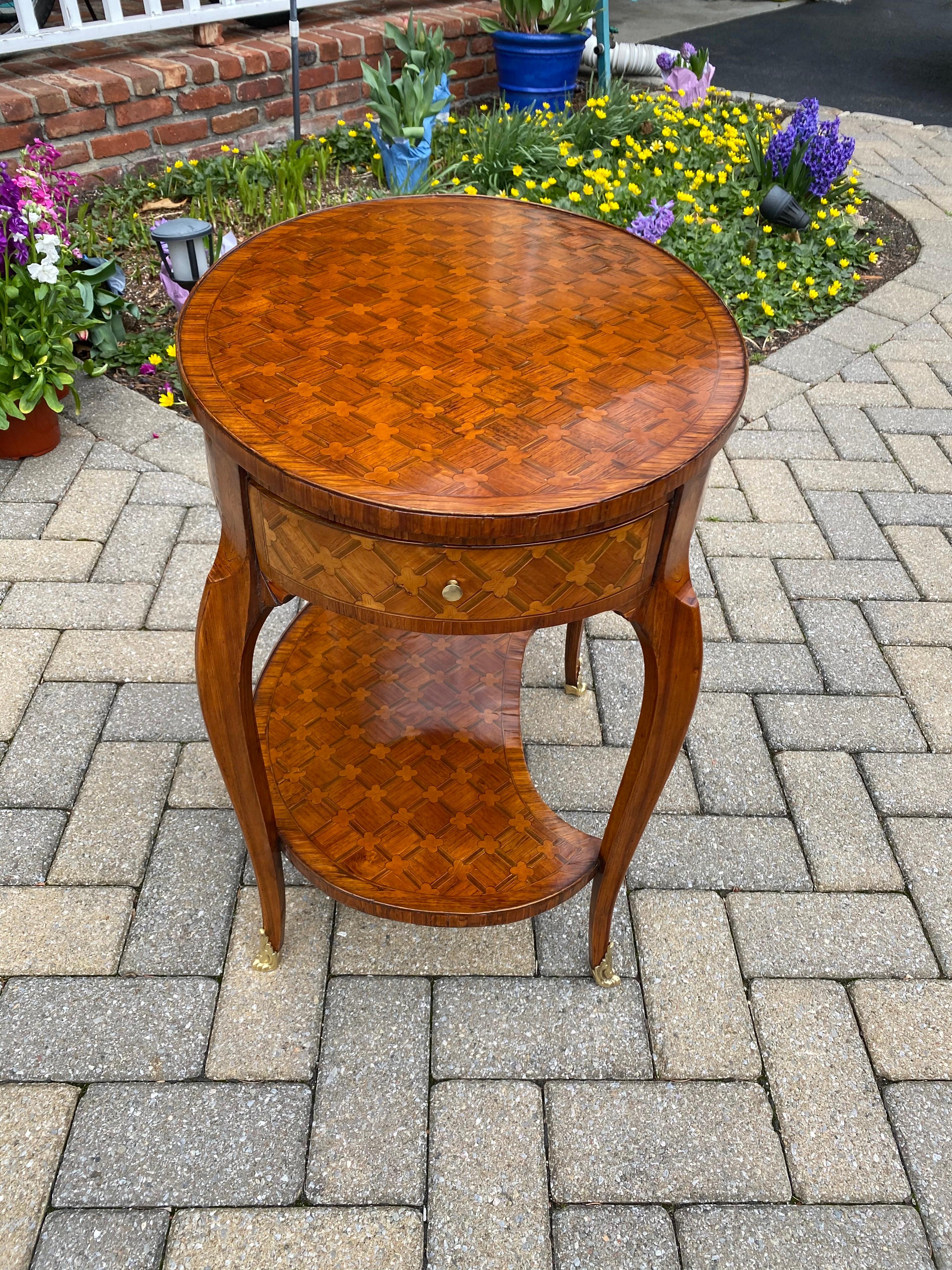 Louis XV parquetry occasional table, 
Circa 1760.