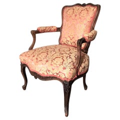 Louis XV period armchair in carved wood, damask upholstery 18th Century Louis XV period armchair in carved wood, damask upholstery 18th Century