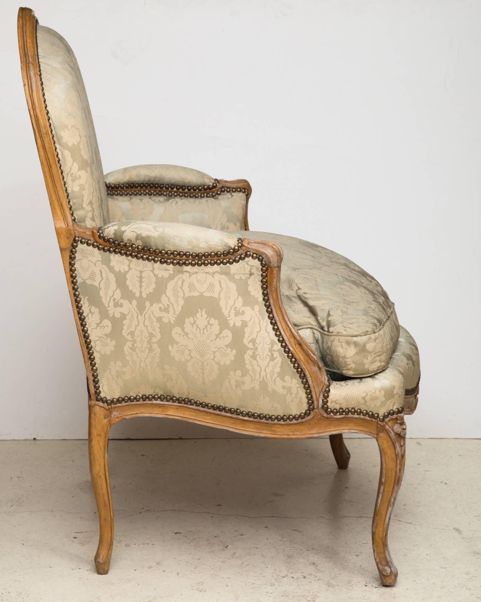 French Louis XV Period Beech Bergere or Armchair Upholstered in Pale Silk Damask For Sale