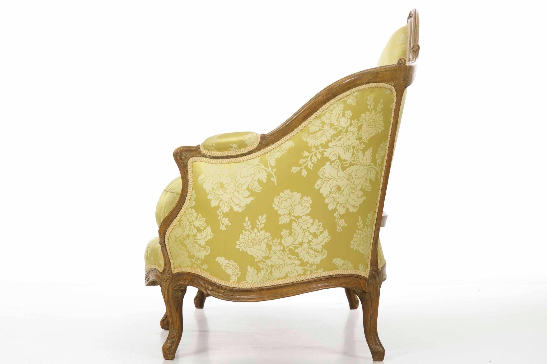 A remarkable piece that has remained in beautiful original condition despite two hundred and fifty years of use, this very fine canapé is of the Louis XV period circa the third quarter of the 18th century. The surface retains a fine early patina