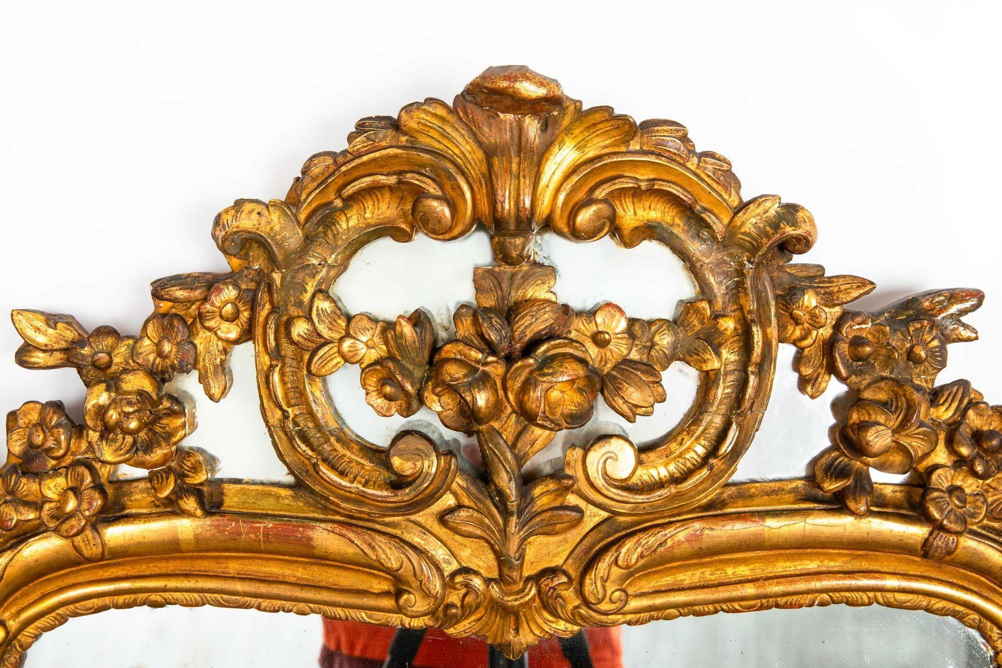 LOUIS XV PERIOD CARVED GILTWOOD WALL MIRROR
France, circa 1750  with much of the original gilding intact
Item # 307QOU13Z 

A wonderful 18th century carved giltwood mirror, the surface is positively gorgeous with oxidization and discoloration from