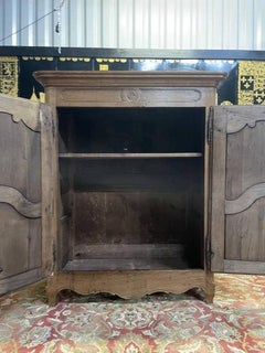 Louis XV period low wardrobe in solid oak
