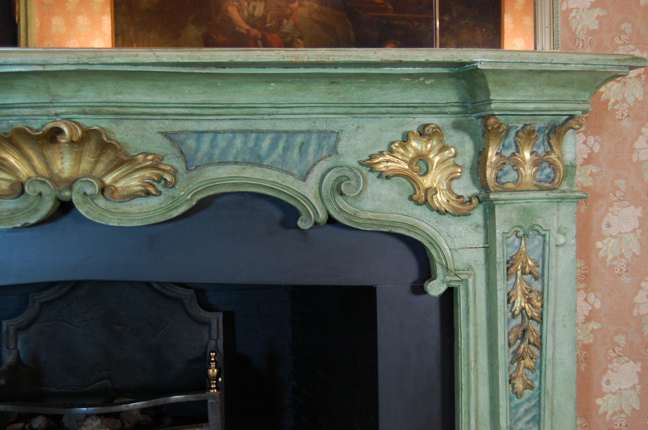 This green painted period carved wooden mantel had been purchased in 1962 from Prince Serge Obolensky of the former Soviet Union, after its removal from his New York City apartment. Old Versailles and the late Mr. Raymond Paioff in New York acted as