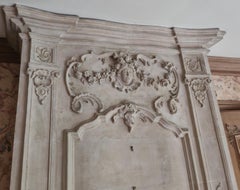 Louis XV period stone mantel with carved overmantel