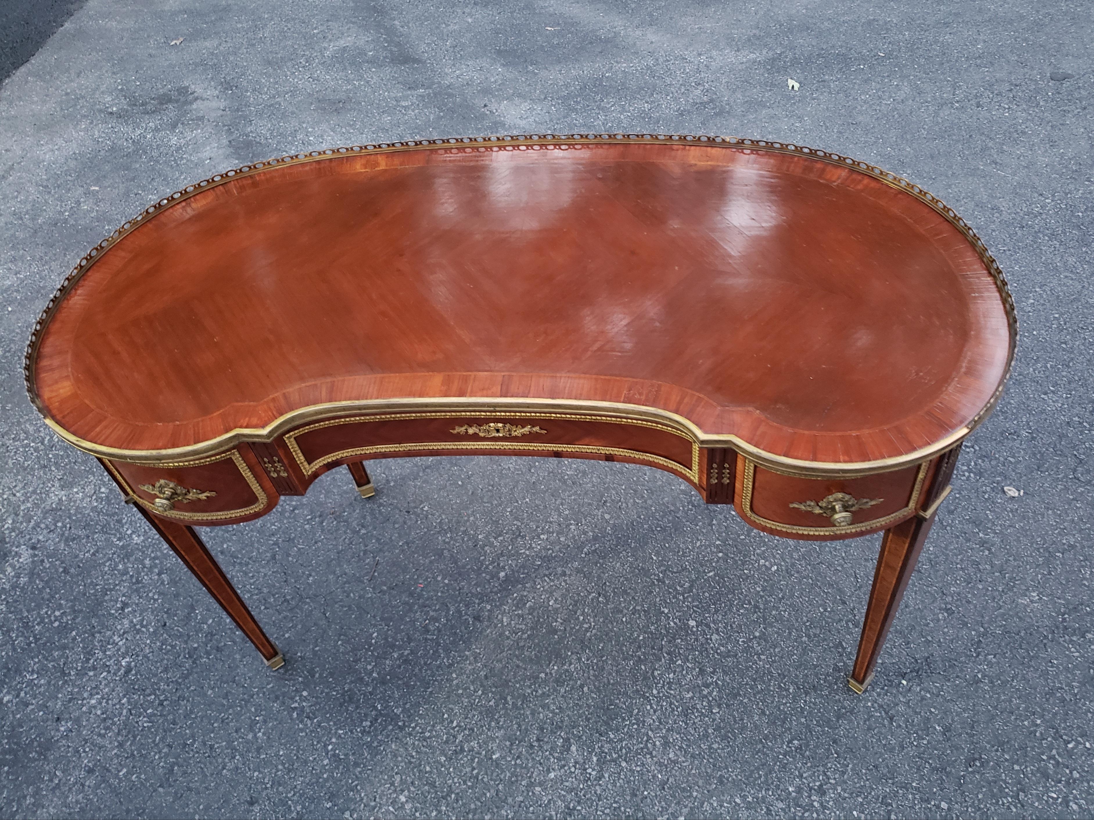 A Recently refinished French transitional kidney-shaped desk. 19th century French transitional design between Louis XV and Louis XVI is timeless, elegant, and understated it works well in modern, contemporary or traditional interiors. This rare