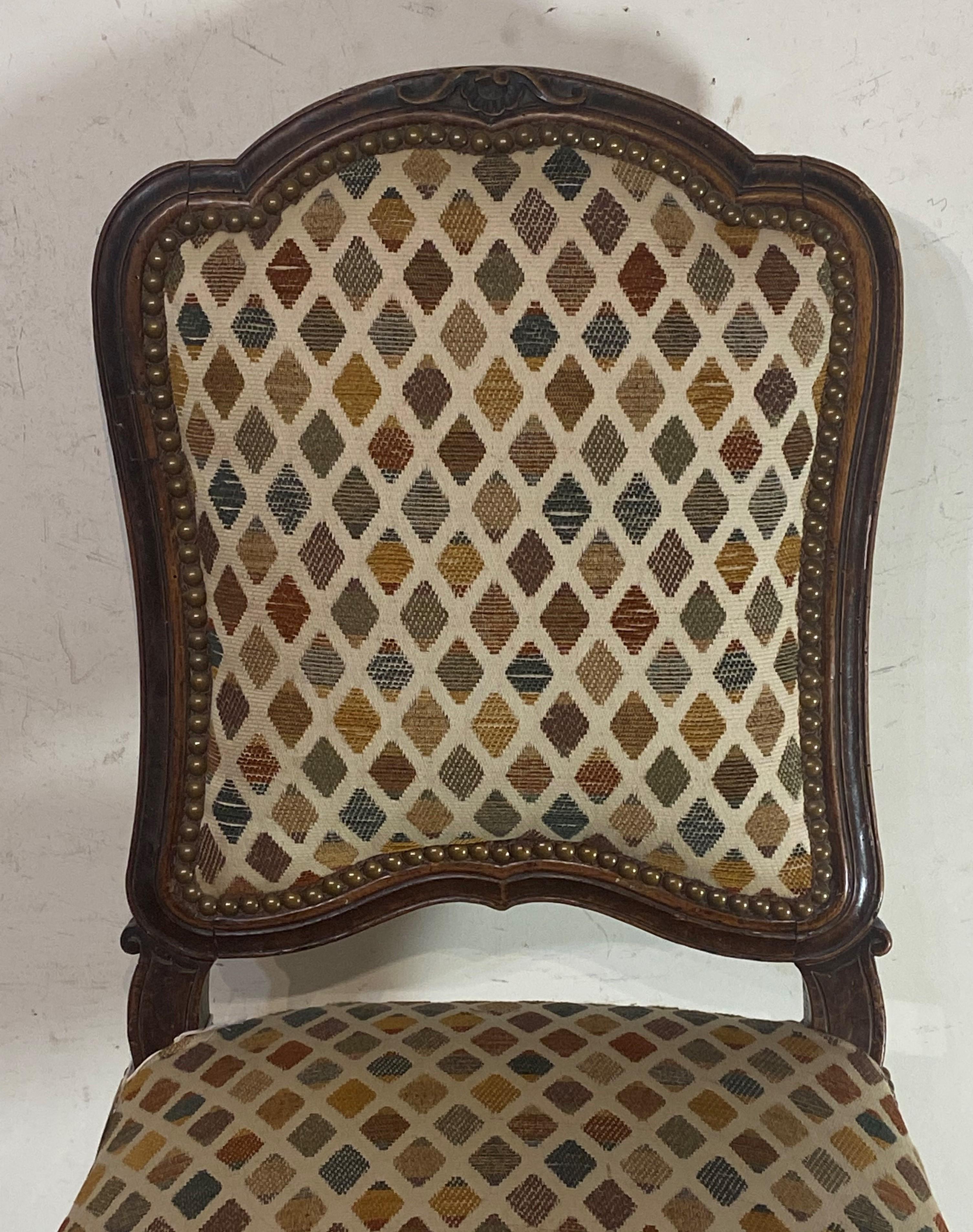 Louis XV walnut side chair, carved walnut. Having nice old classy fabric and blessed with unusual bold proportions since French seating furniture is normally low. Great old patina.