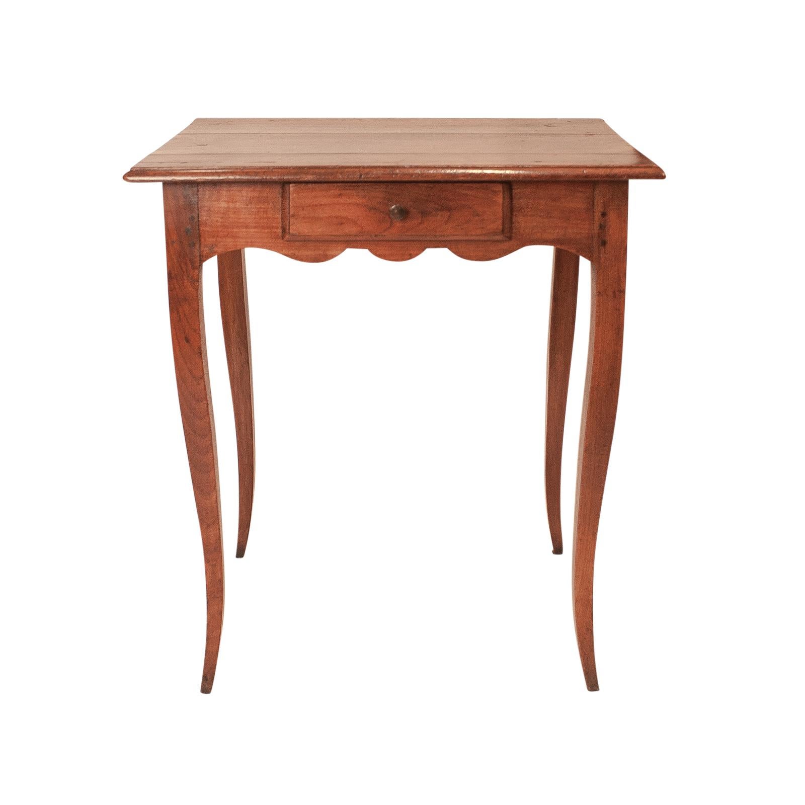 A mid-18th century French Louis XV period Provincial cherry one drawer writing table, circa 1760.