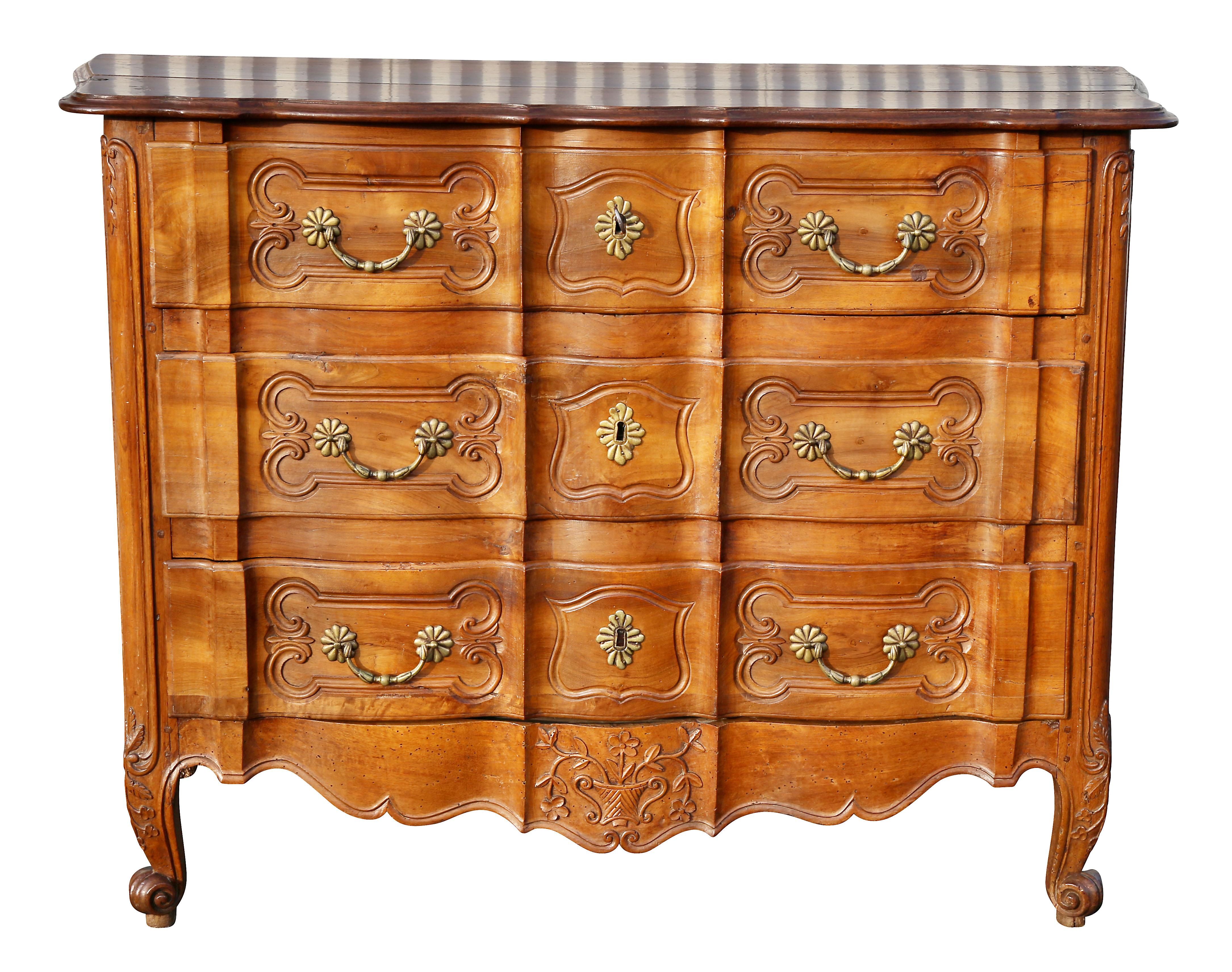 With serpentine rectangular top over three conforming drawers and a carved shaped apron raised on cabriole legs and scroll feet. Paneled sides.
Provenance: Fogg Estate, Chestnut Hill Mass.