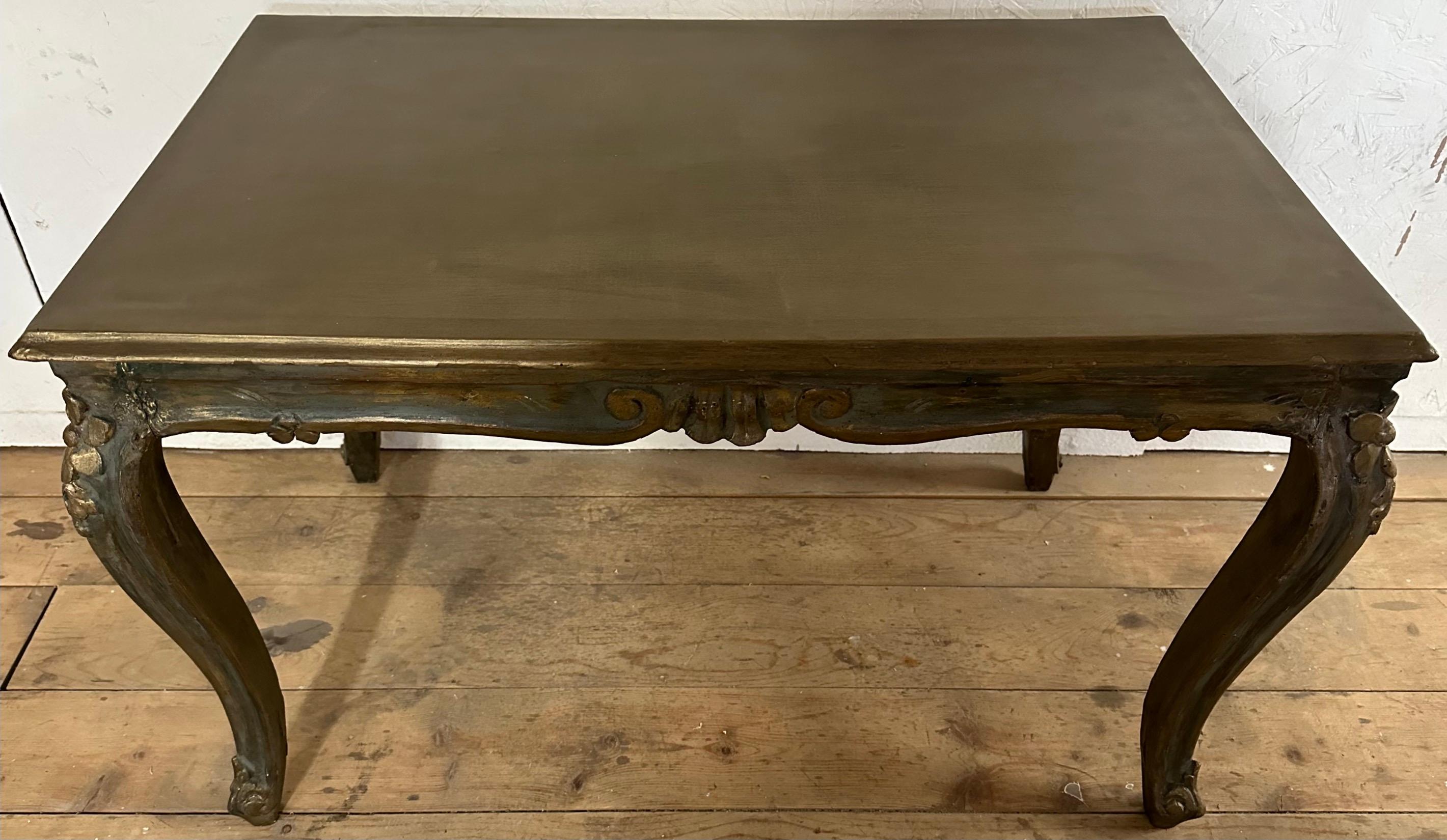 An elegant vintage French Louis XV style carved and painted coffee table with gilt wood accents. This table will add a touch of timeless sophisticated elegance to any space where a small coffee table is needed.

Search Terms: Empire style, rococo,