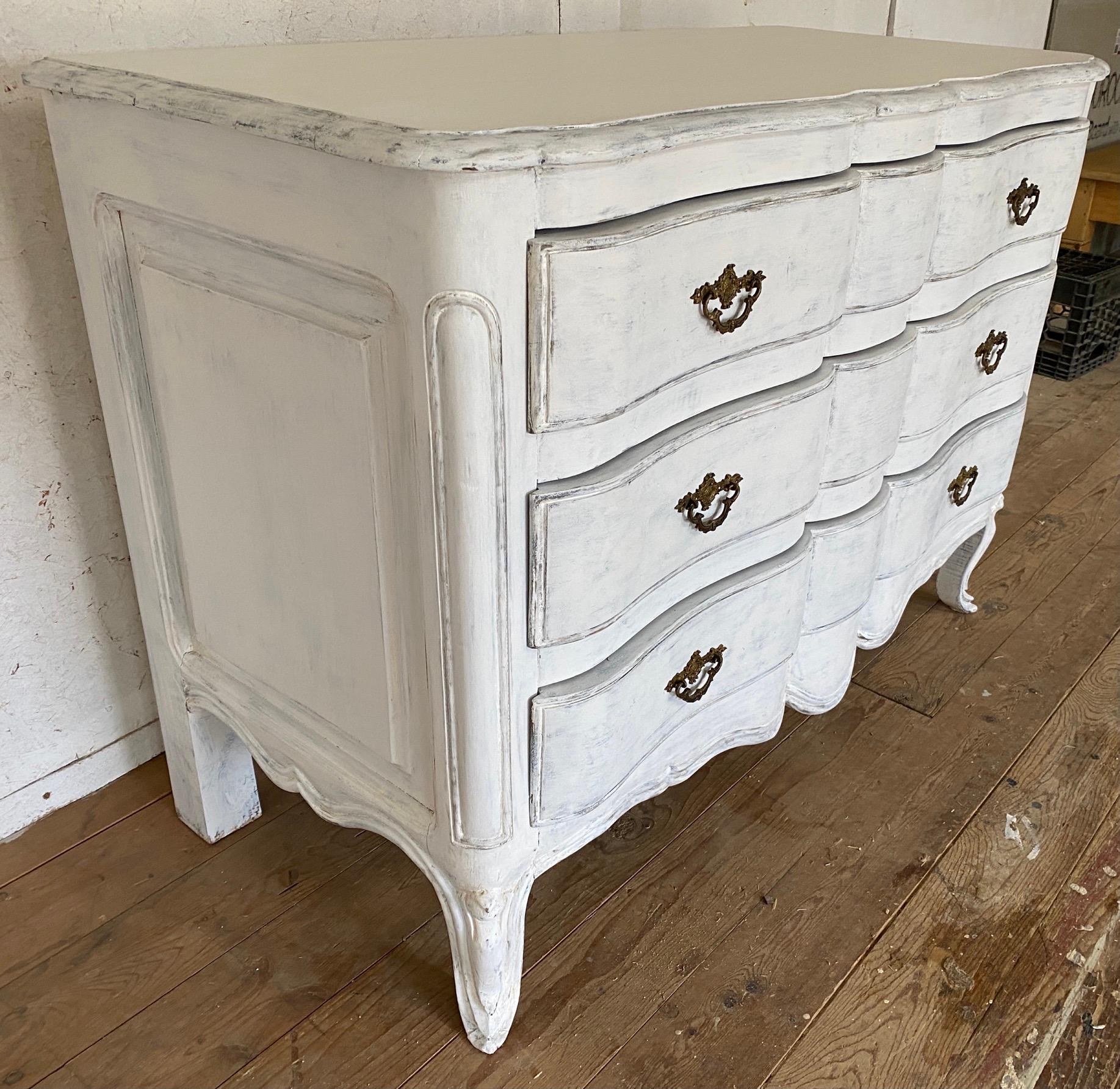 Louis XV Provincial style painted commode or chest of drawers with wonderful details. Painted wood with trim detailed, decorative hardware.
