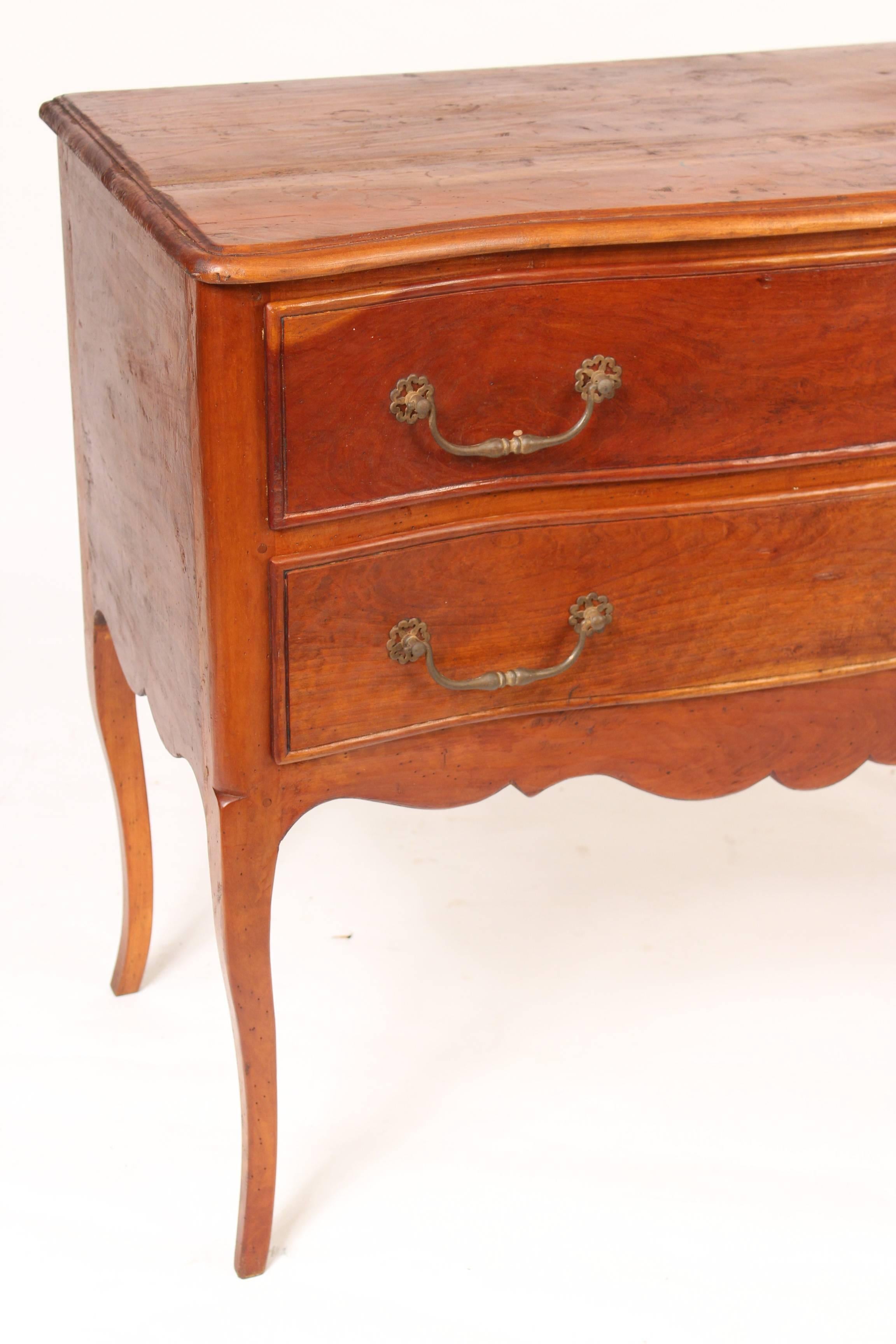 Louis XV provincial style, beech wood, serpentine front, two drawer, chest of drawers with steel pulls, circa 1900.