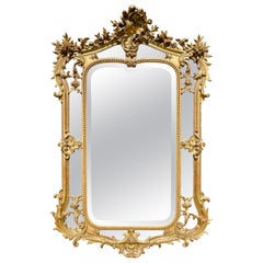 Specchio con serbatoio in stile Rocaille Luigi XV, legno dorato e gesso dorato, XIX secolo