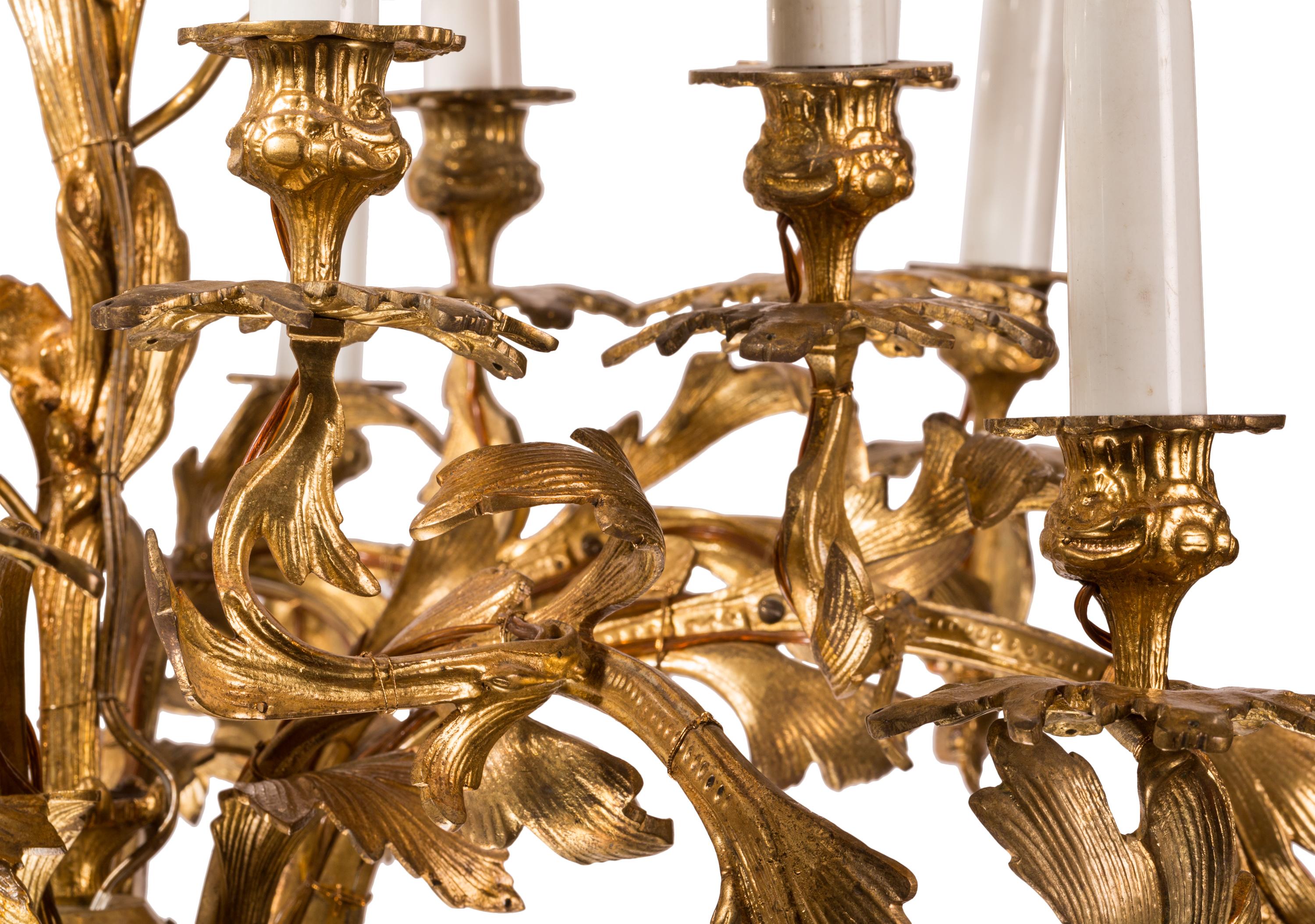 French Louis XV Rococo Style 16-Light Bronze Chandelier with Leaf and Flower Motifs For Sale