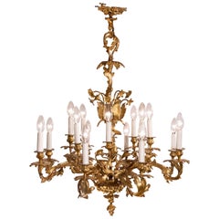 Antique Louis XV Rococo Style 16-Light Bronze Chandelier with Leaf and Flower Motifs