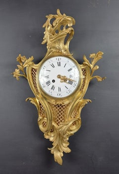 Horloge murale Louis XV de style rococo en bronze doré