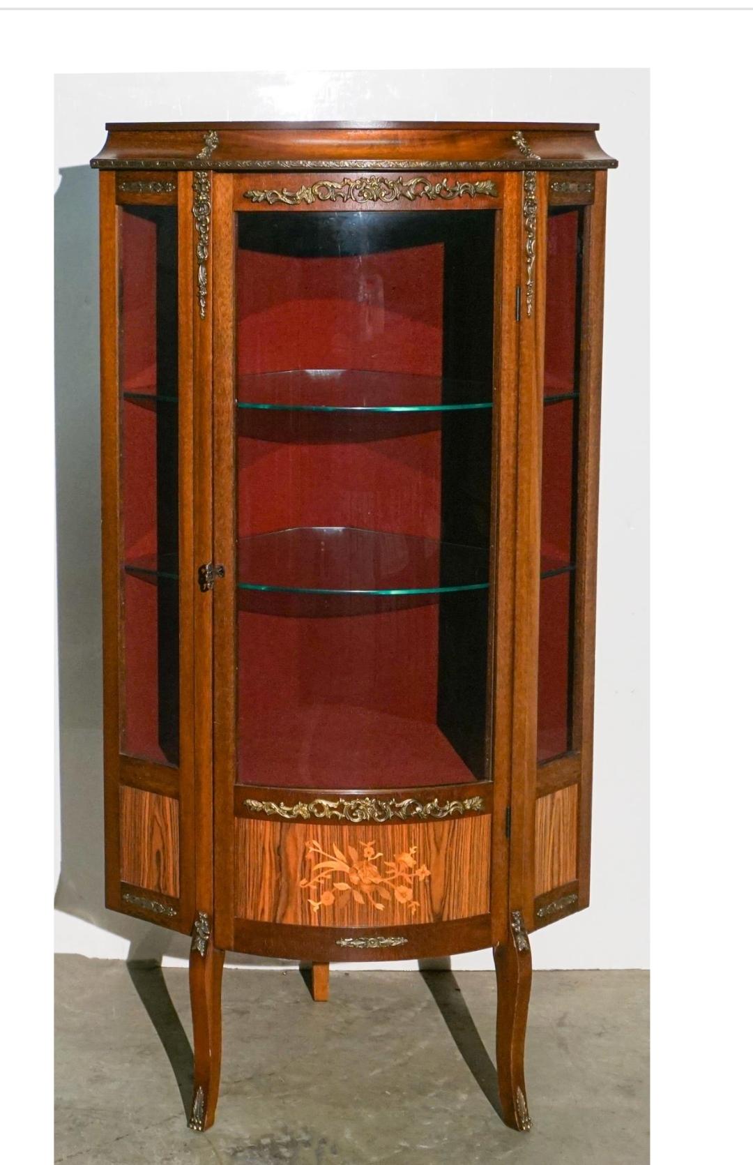 A Louis XV Style Satinwood Inlaid Mahogany Parquetry and Marquetry Corner Cabinet.
Lock and key present and functional.
Measures 28