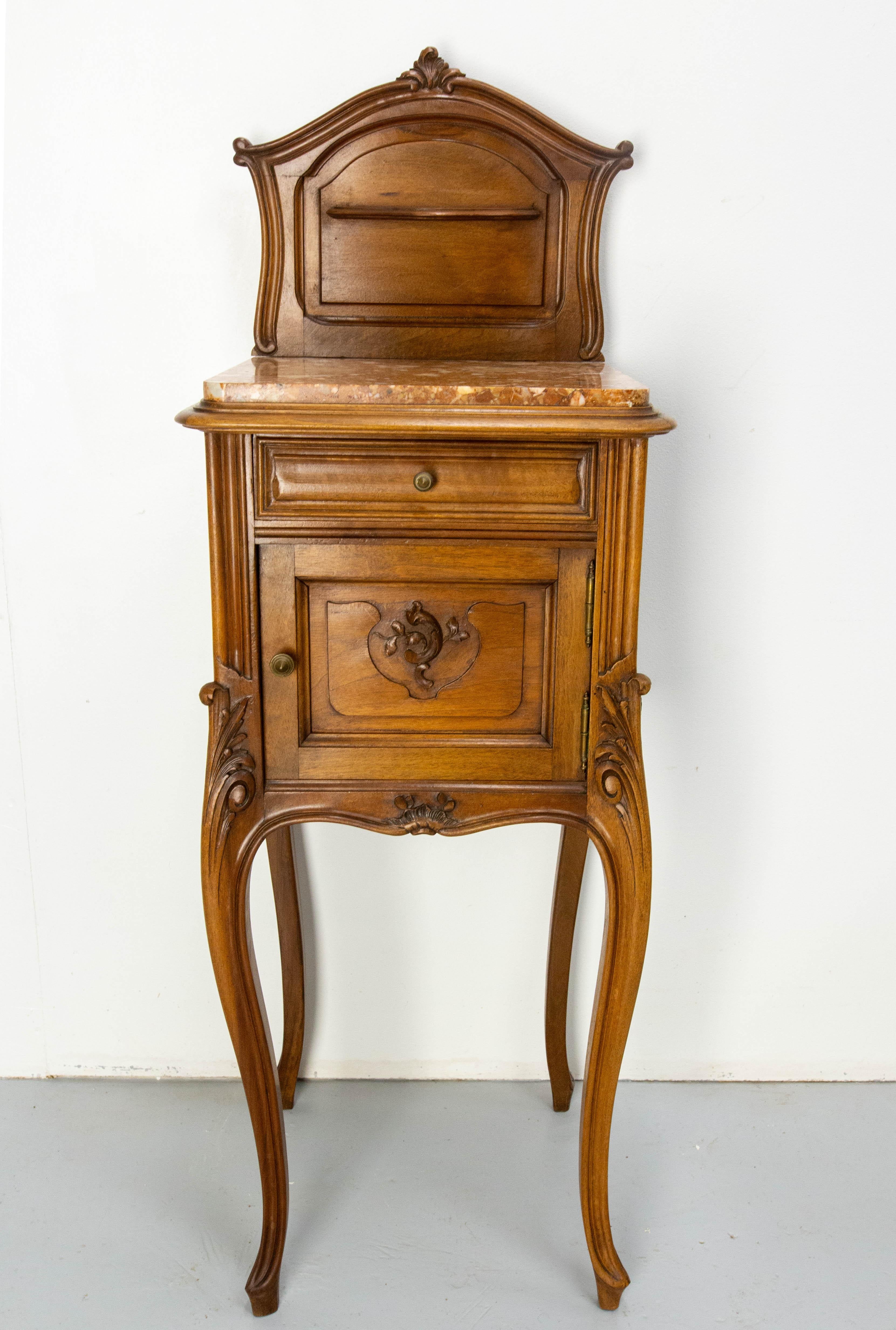 French side cabinet Louis XV style nightstand
20th Mid-century
Massive walnut bedside table with ornement of vegetal inspiration
One drawer and door.
Height to marble 88 cm/35 in
Very good condition.

Shipping:
87/40/40 16.2 kG