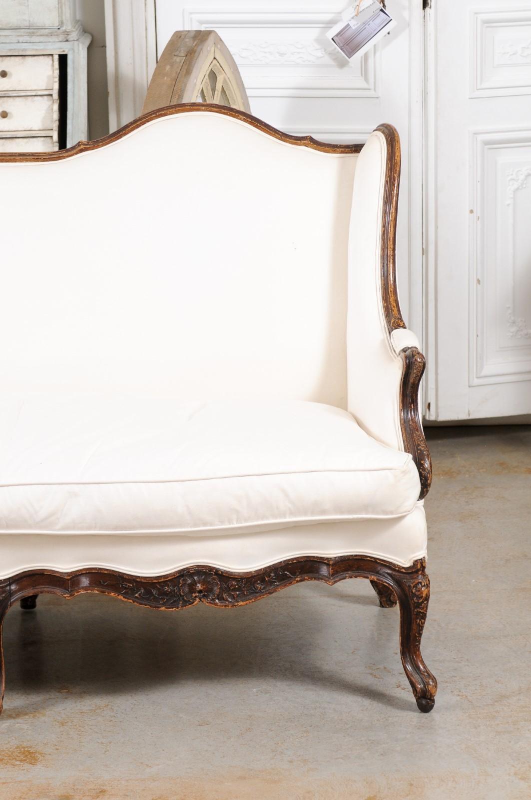 Upholstery Louis XV Style 19th Century French Walnut Wingback Canapé with Cabriole Legs