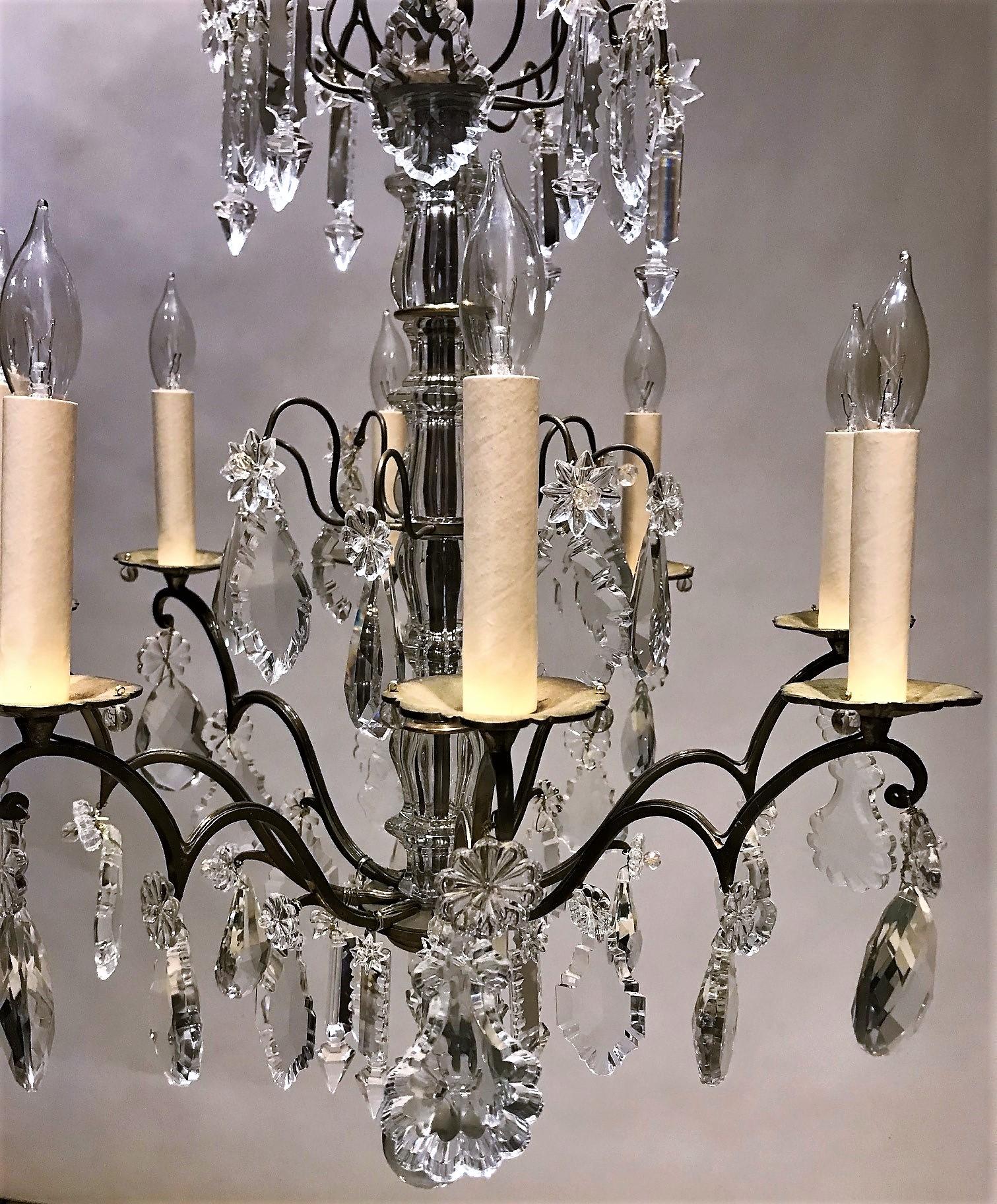 Beautiful faithful reproduction of an 18th Century Louis XV design. The 6-light frame is hand-cast solid brass with hand-cut lead crystal prisms in the Baccarat style. Ceiling cap, hanging hardware, and 1 foot of chain included.