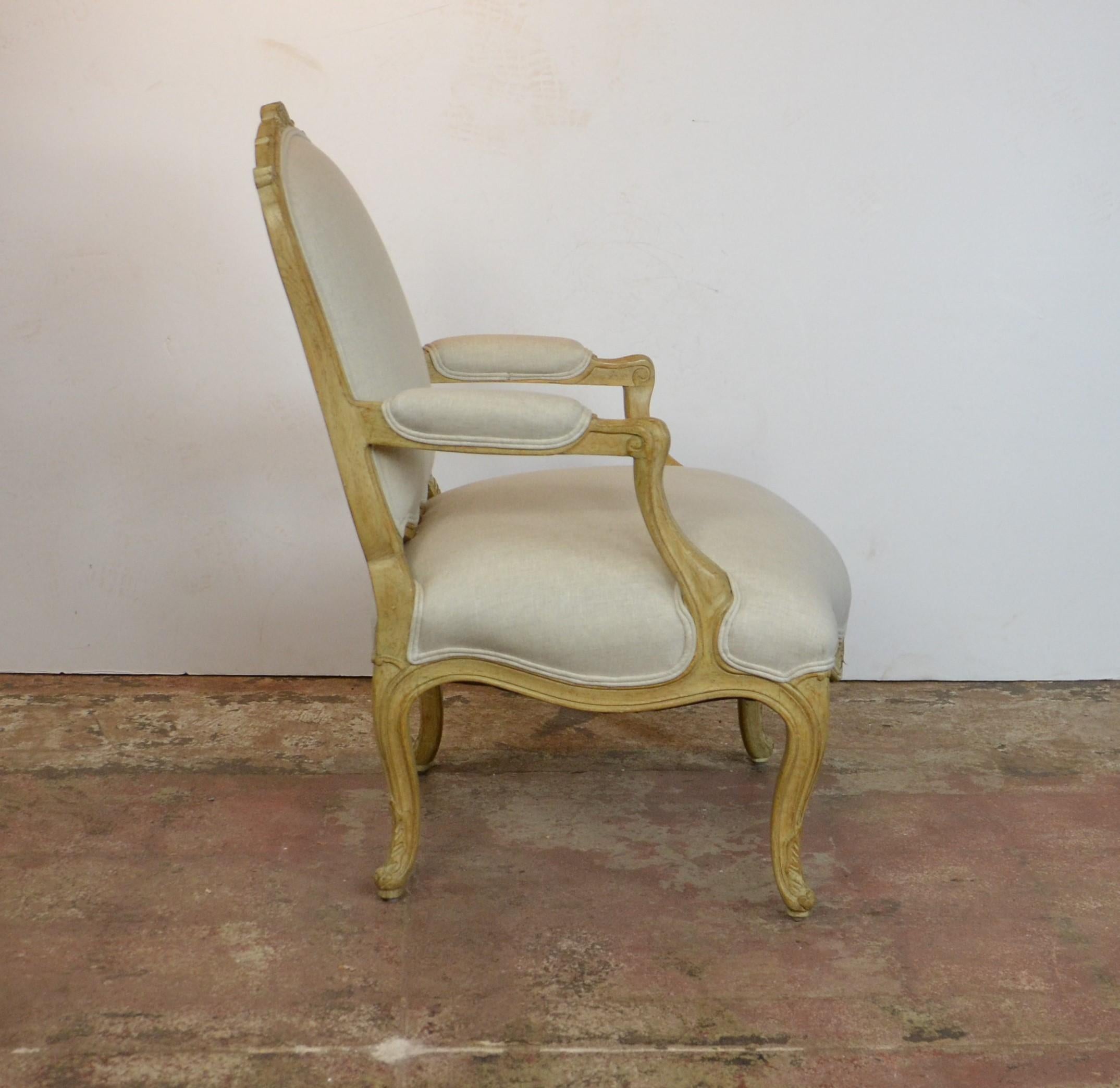 Louis XV style armchair. Upholstered in linen. Measures: Arm 24