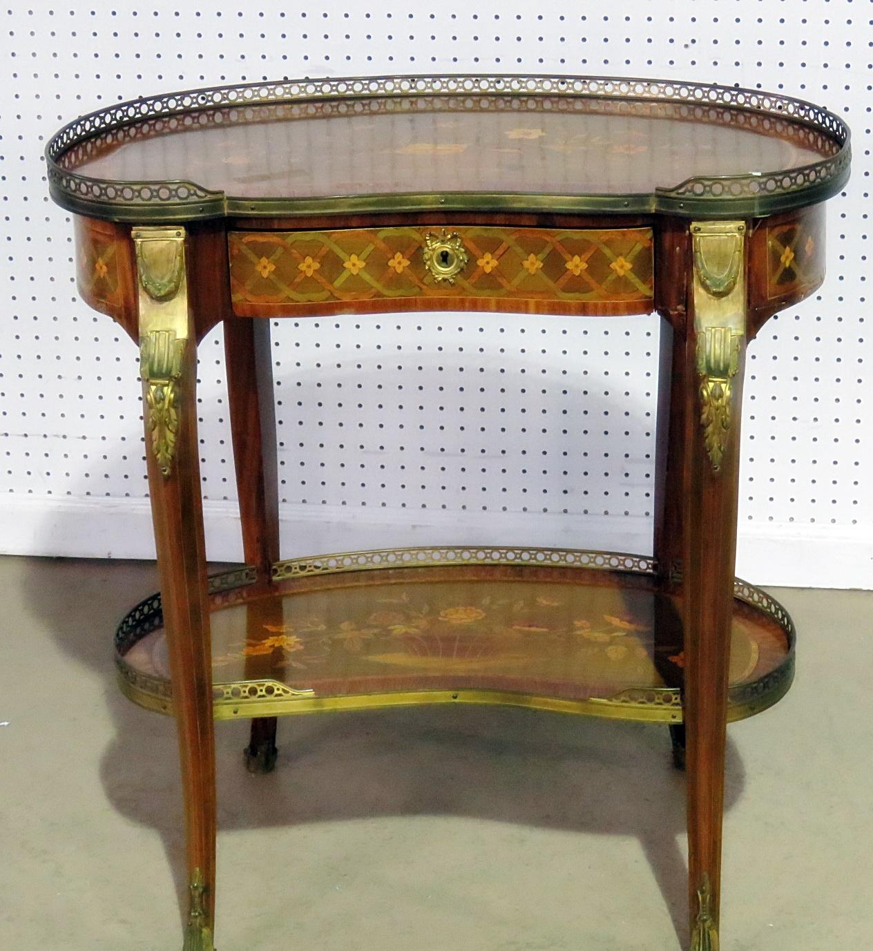 Louis XV style intricately inlaid one drawer accent table with a brass gallery and mounts.