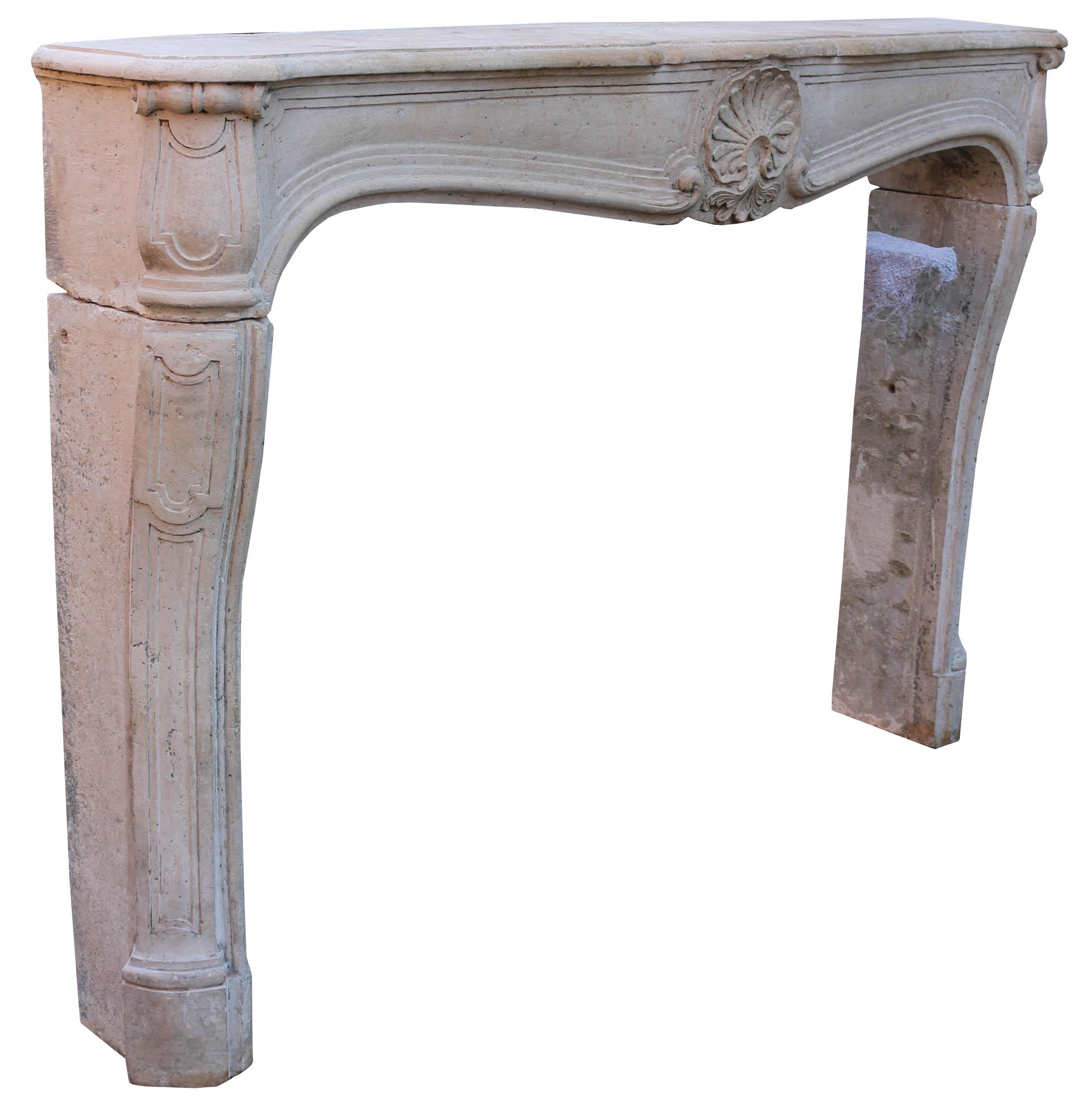 A large French Limestone fireplace surround with panelled jambs and frieze, centred by a shell cartouche.

Additional dimensions

Opening height 102 cm

Opening width 149.5 cm.