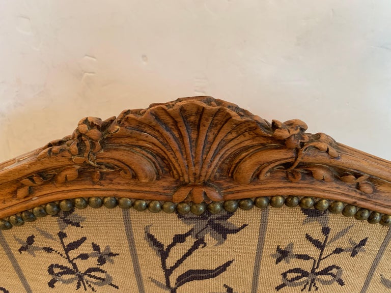 19th century French beechwood fireplace screen, once used to soften the heat from a roaring fire in the hearth of a grand Maison in France. It can serve a home today as a beautiful decorative shield in the off-season, providing stylish coverage for