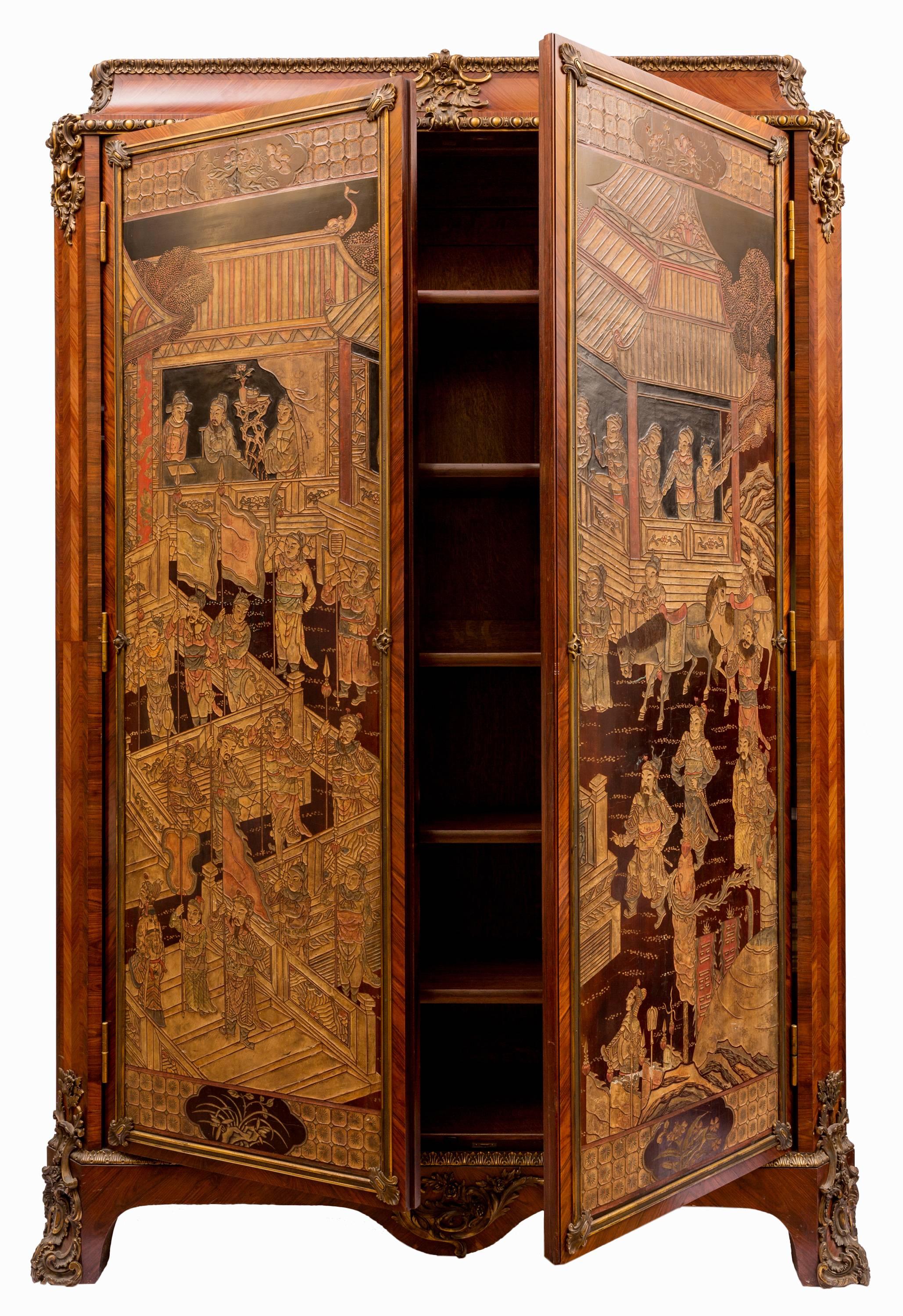 This 19th century French Armoire in Louis XV style has two full-length Chinese Coromandel lacquered panels decorating its front doors. The panels are matched, and present a detailed scene with many Chinese figures in a moment of pageantry. The form