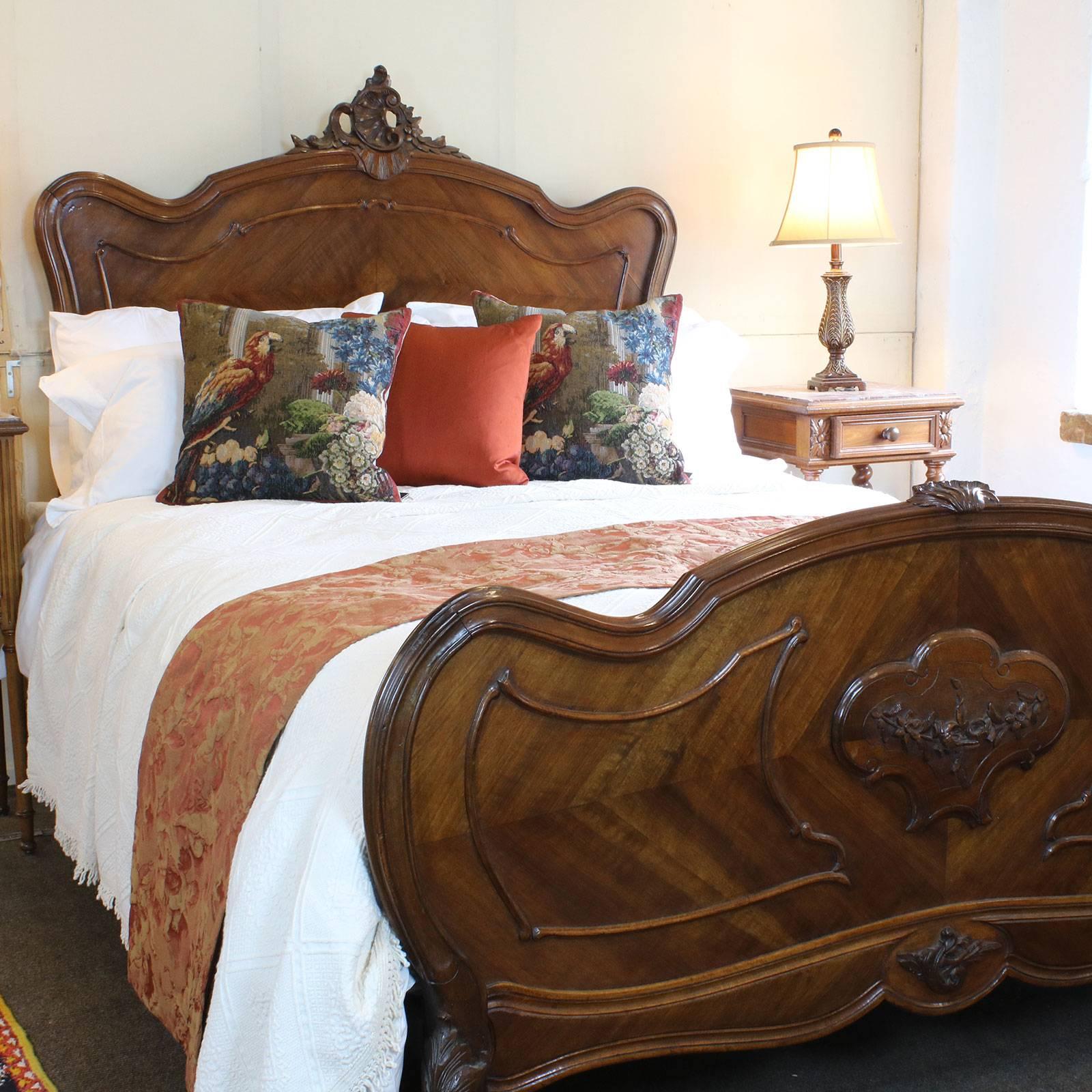 A French Louis XV style bed with ornate carving on the head panel and shaped head and foot boards.
This bed accepts a British king-size or American queen-size (60 in wide) base and mattress set.
The price is for the bedstead alone.