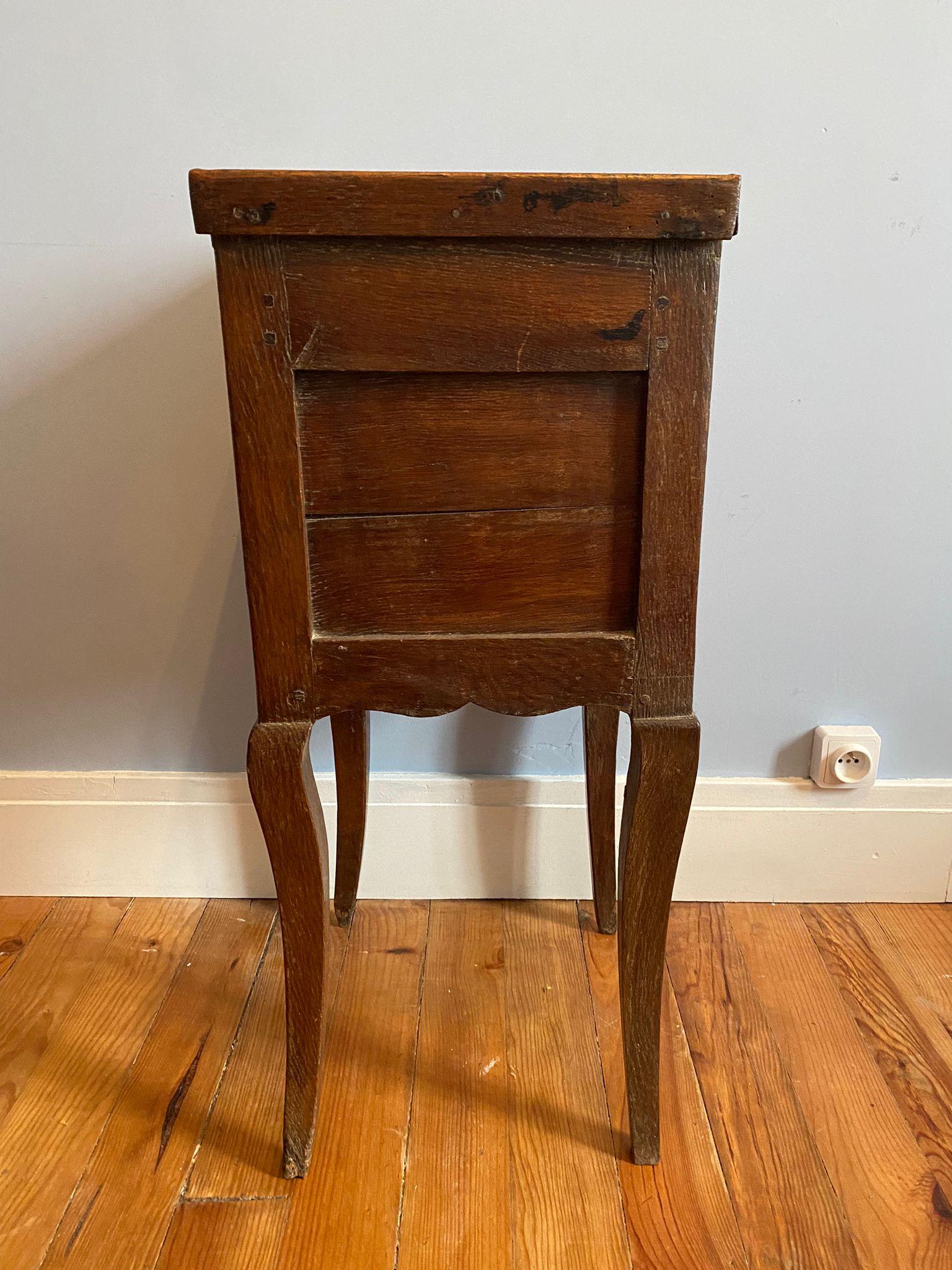 Nice little 18th century bedside table, Night Table, Nightstand from the Louis XV period. 
The legs are curved, there is a drawer along the length of the top rail and a central hollow space for placing objects.
Very Beautiful French work

XVIIIth -
