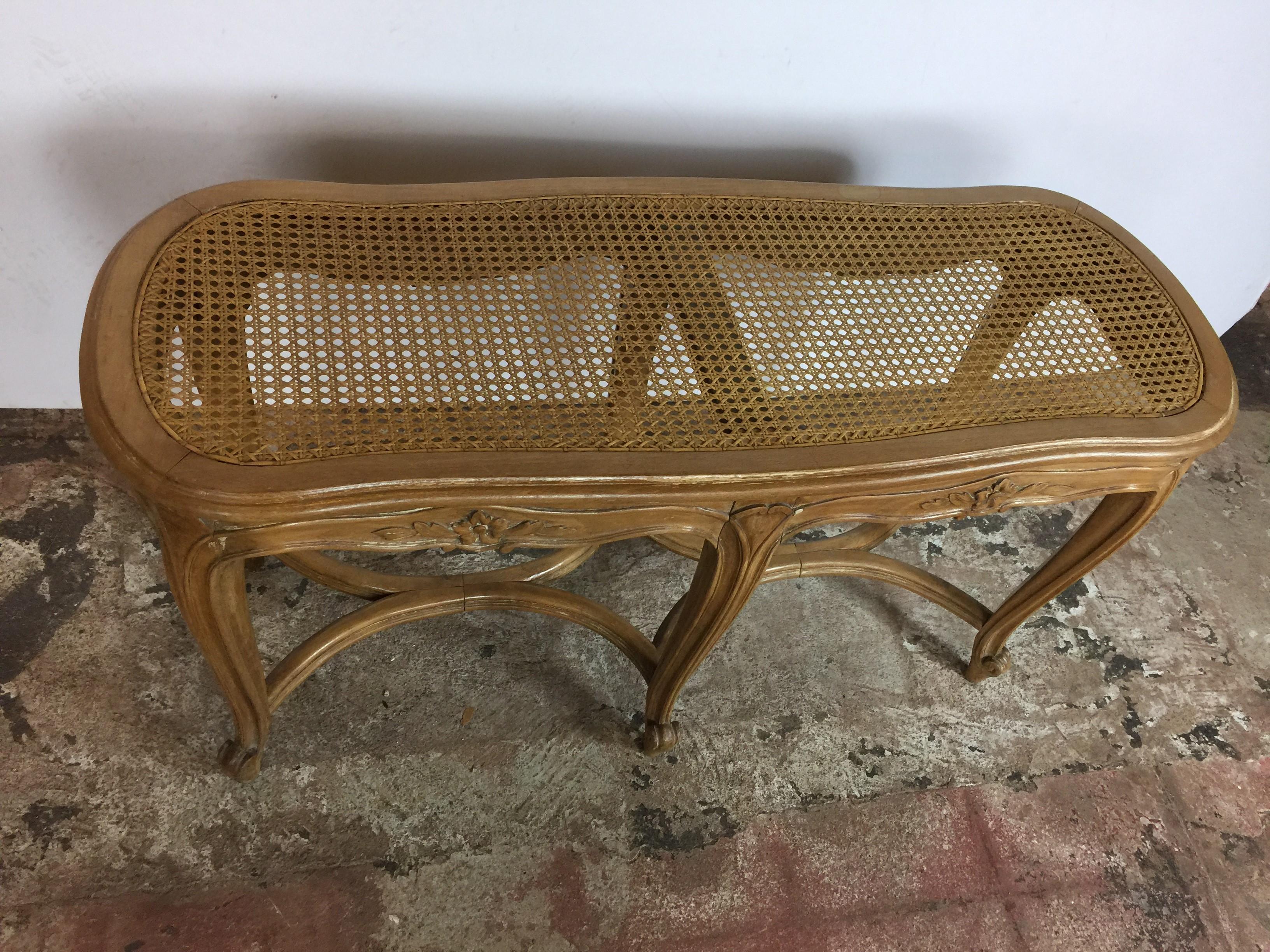 Louis XV style cane seat bench. 
The bench has a beautiful natural finish.