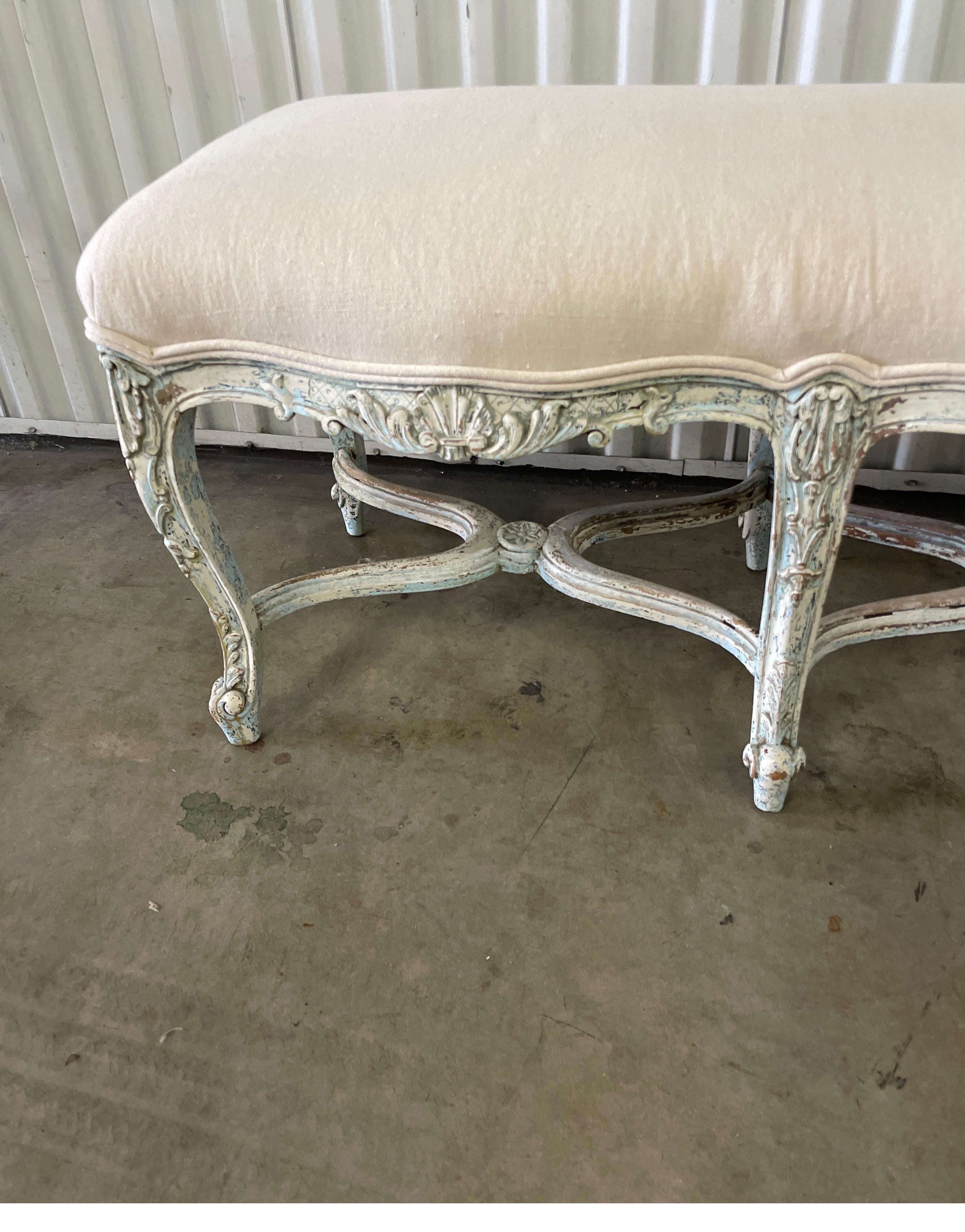 Beautifully carved and painted Louis XV style bench with newly upholstered seat.