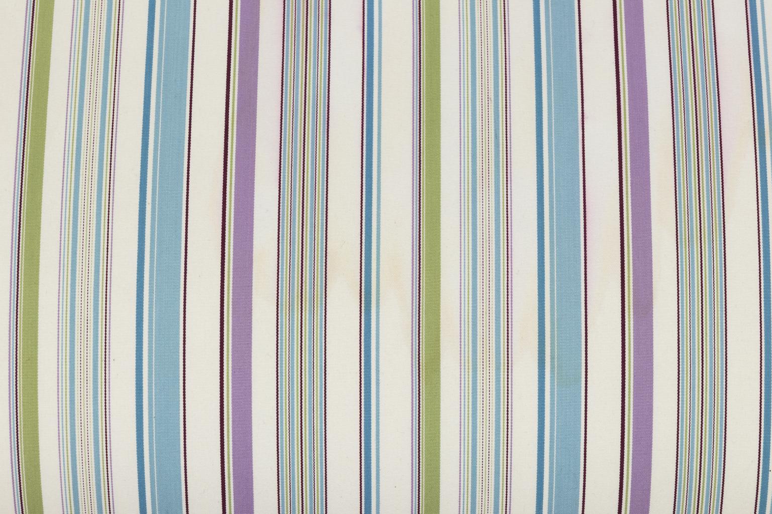 Louis XV style upholstered bench with soft blue, purple and green striped cotton fabric, circa 20th century. The bench also features gimp trim and turned legs.
     