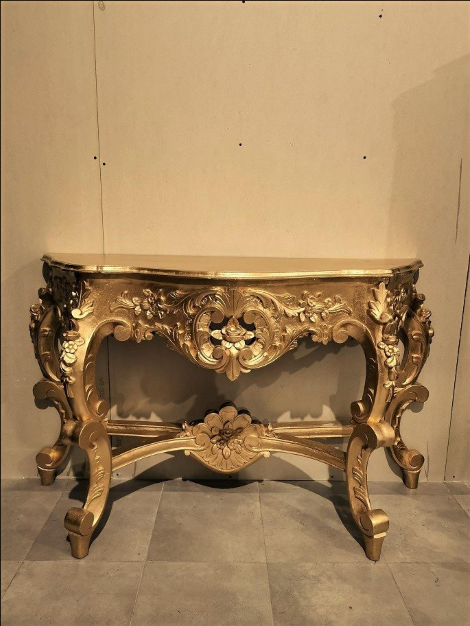 Big size elegant golden wood console table in Louis XV style.
France 20th century.
  
