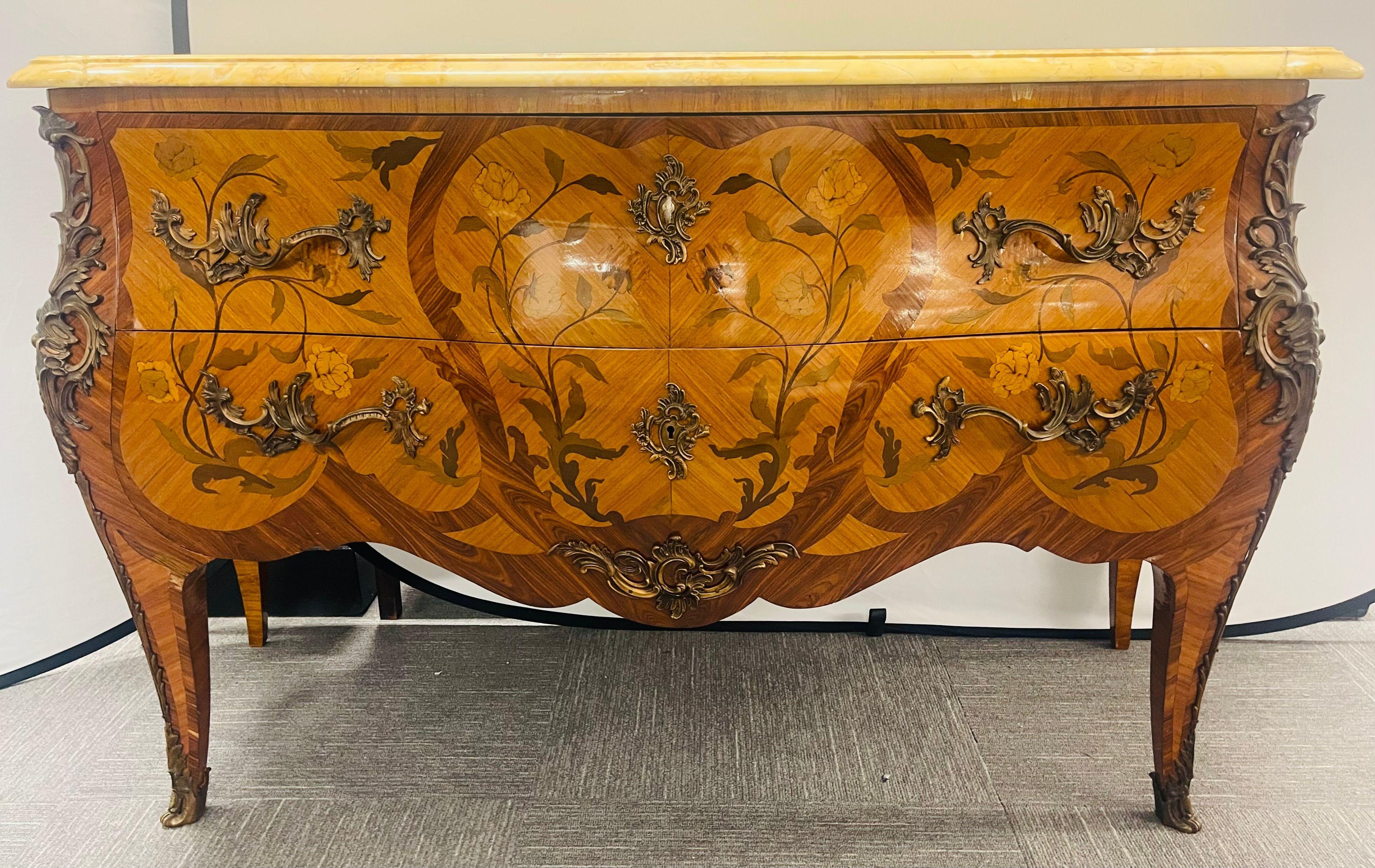A finely crafted Louis XV style commode or chest of drawers. The whole having oak secondaries with bronze mounts and full bronze mounted corners running from the full shoe sabots to the top of the chest. The chest having a wonderful floral and vine