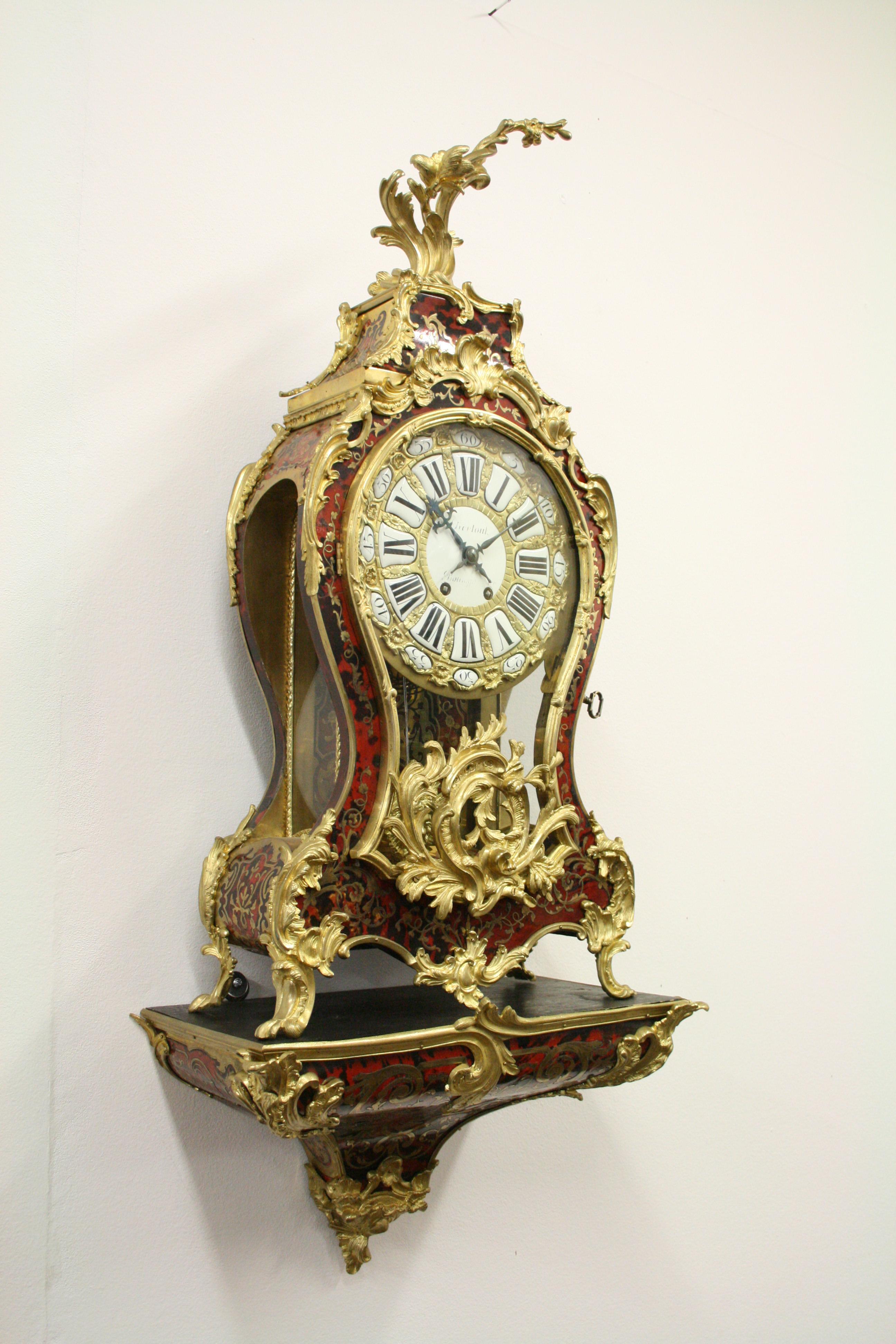 Louis XV style boulle marquetry bracket clock, the scrolled foliate gilt metal pediment above a waisted case with further gilt metal mounts, terminating in scrolled paw feet, the gilt dial with enameled Roman numbers, signed 'Bertout, Borronger