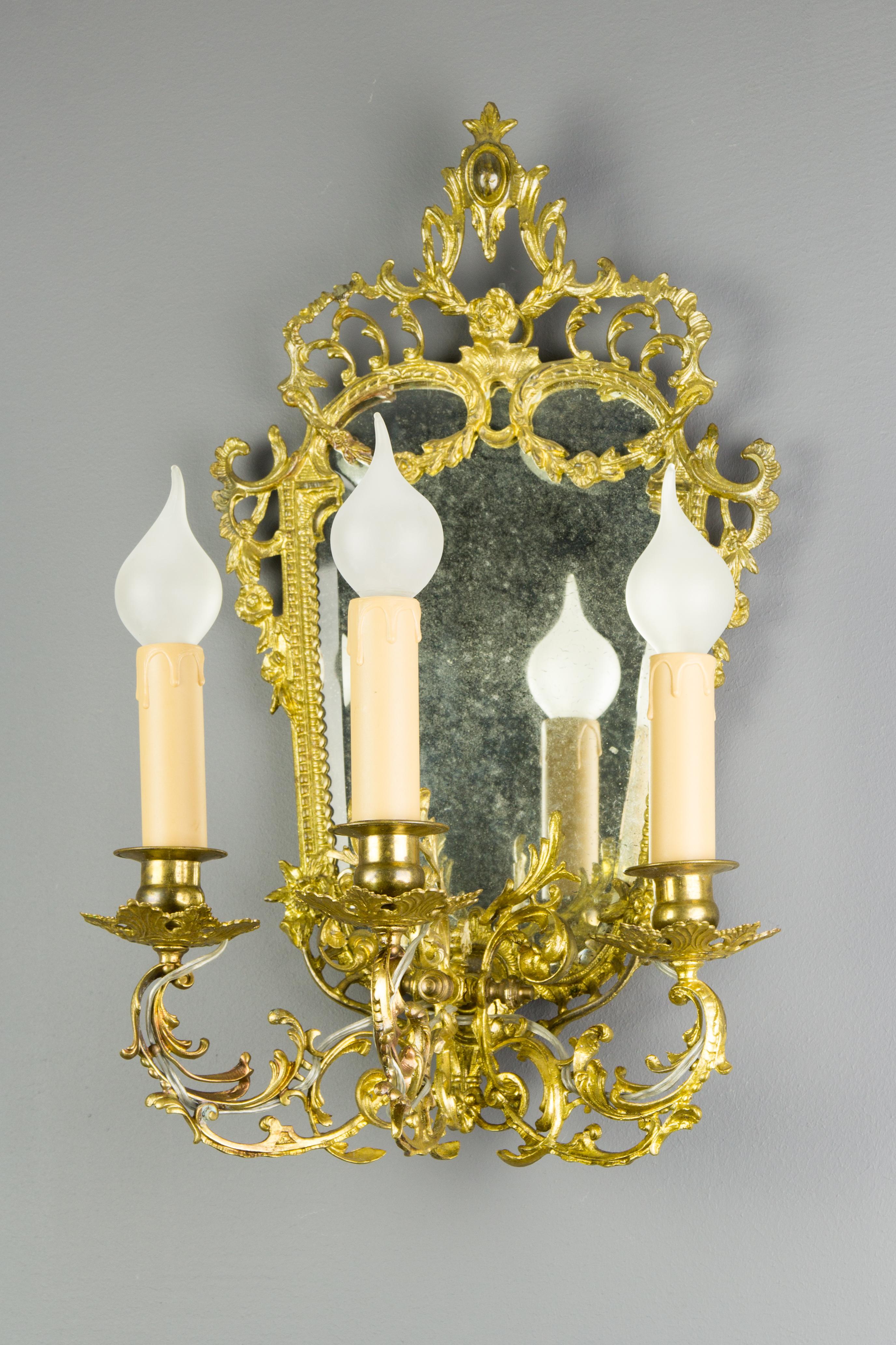 Beveled Louis XV Style Brass and Bronze Three-Arm Mirrored Girandole Wall Sconce For Sale