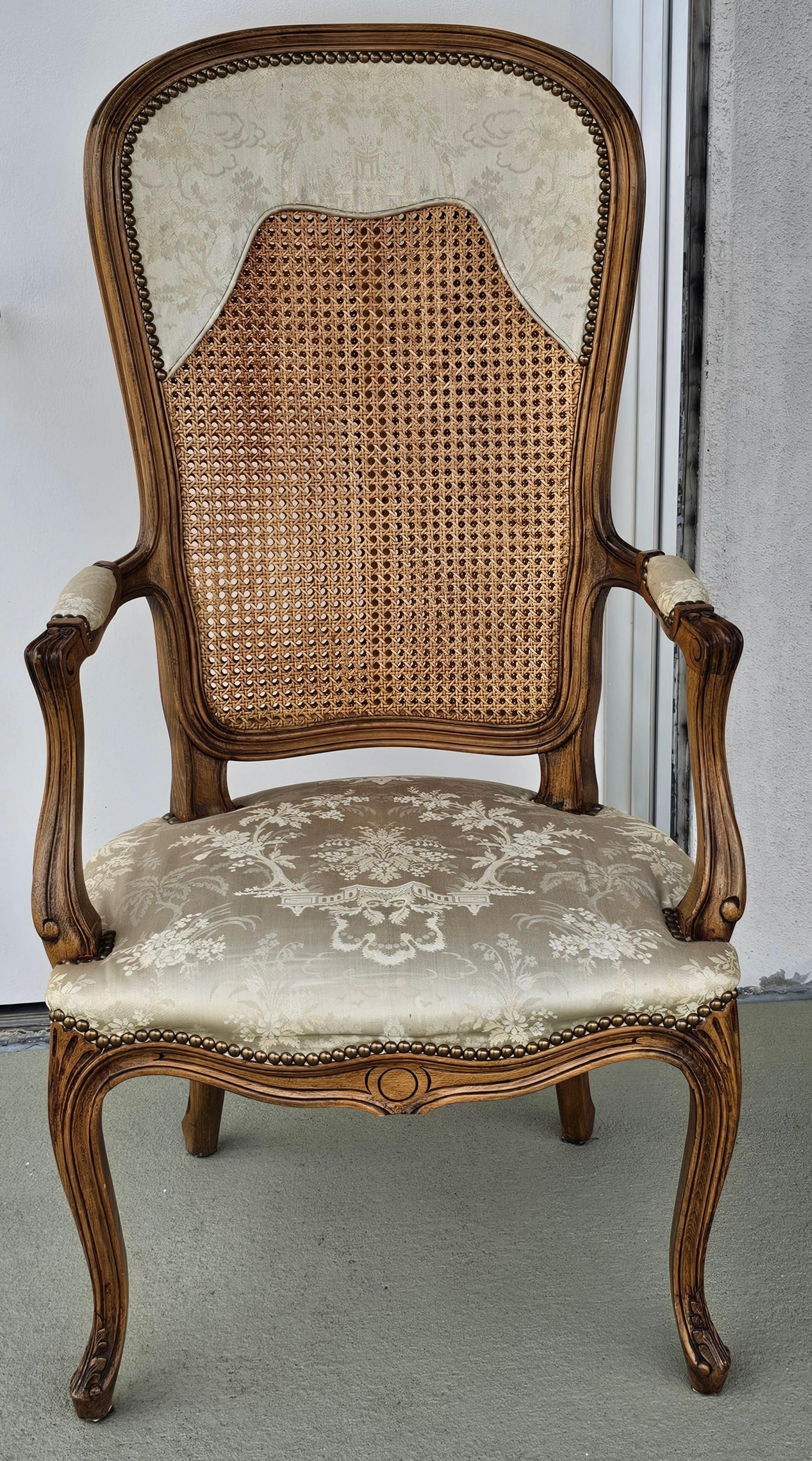 Italian made Louis XV Style Brass Nail Studded, Caned and Partial Upholstered Fauteuil. Double cane back with extra wood bar support as part of the frame.
Measures 24