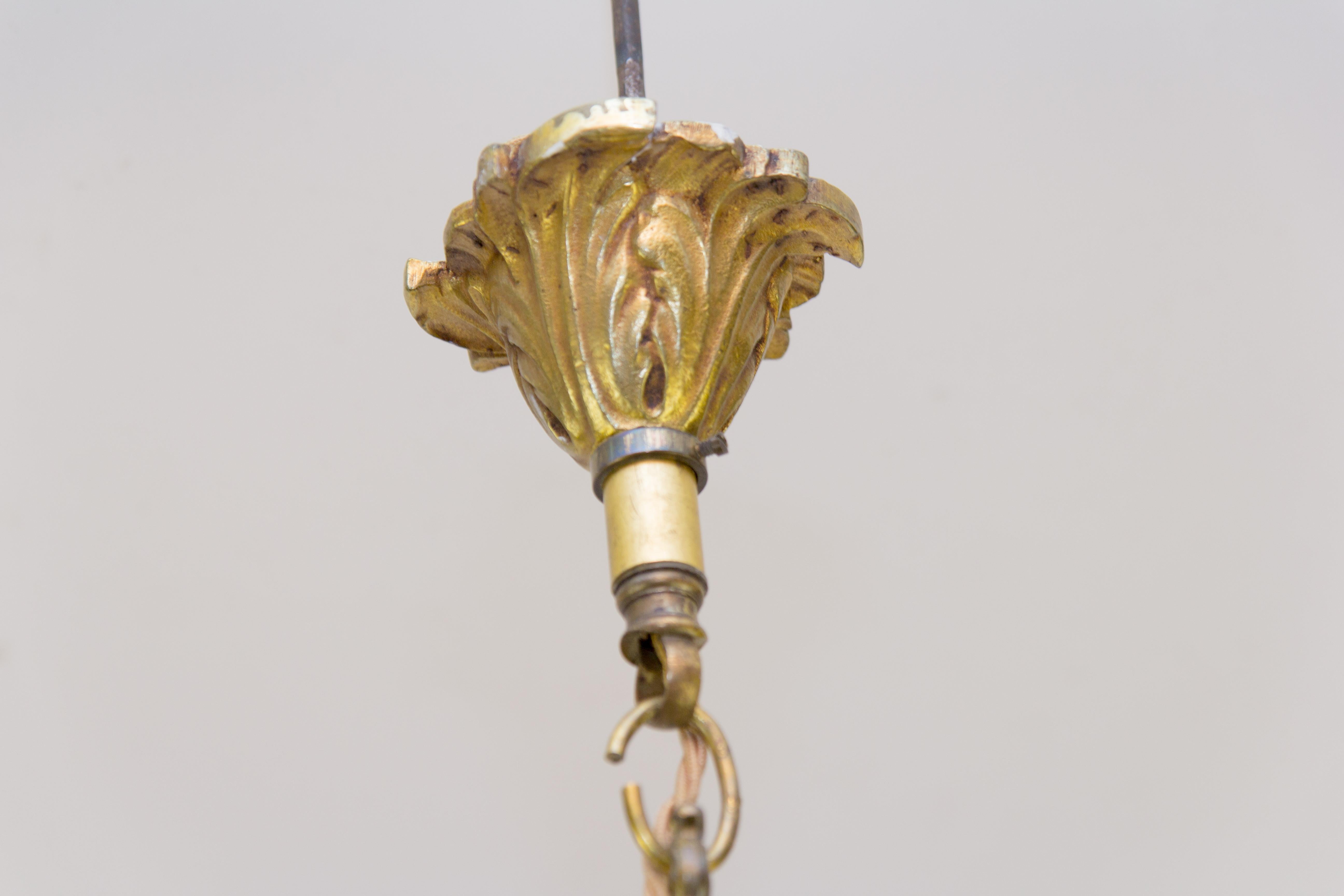Milieu du XXe siècle Lustre à quatre lumières de style Louis XV en bronze et cristal en vente