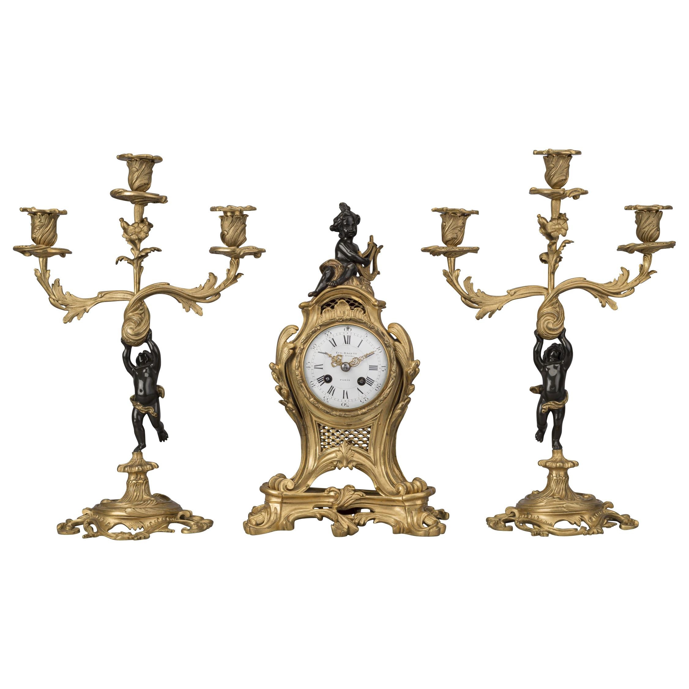 Garniture d'horloge figurative de style Louis XV en bronze de la Maison Baguès:: France:: datant d'environ 1870