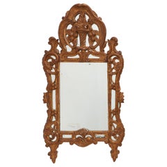 Louis XV style carved giltwood mirror with floral crest, France, 18th century