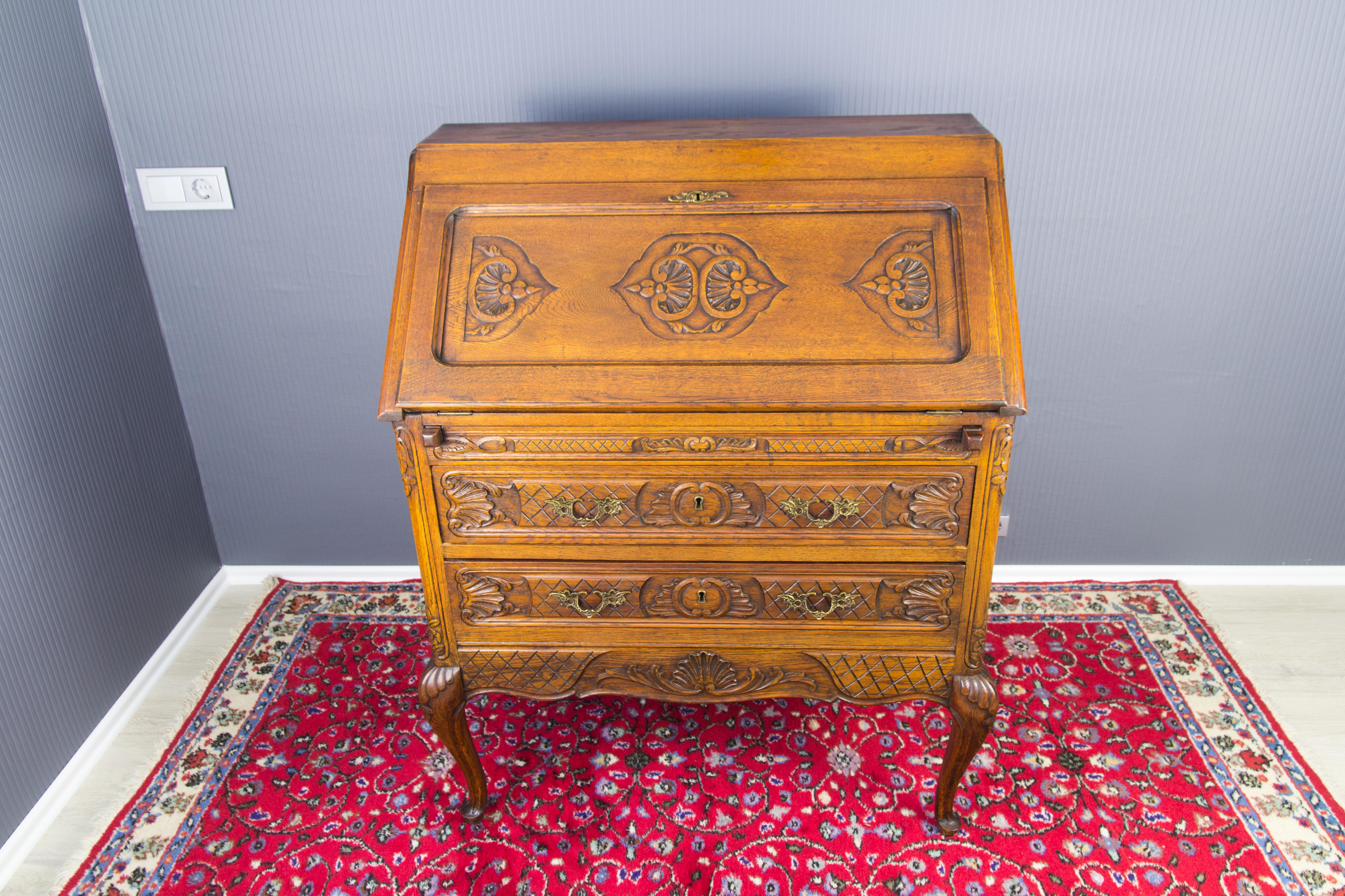 French Louis XV Style Carved Oak Drop Front Two Drawers Secretary Bureau, 1920s For Sale